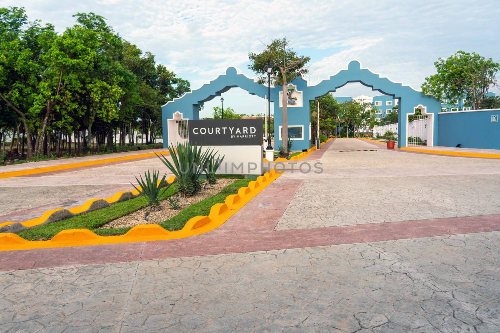 Cancun, Mexico - 16 September, 2021: Courtyard by Marriott hotel entrance with blue and yellow architectural design