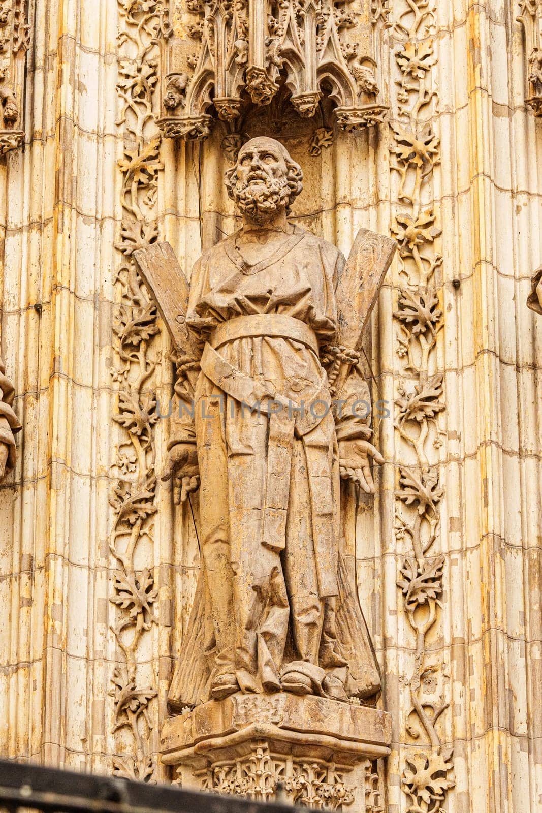 Statue of the apostle Saint Andrew on the Assumption Gate of the Cathedral of Seville