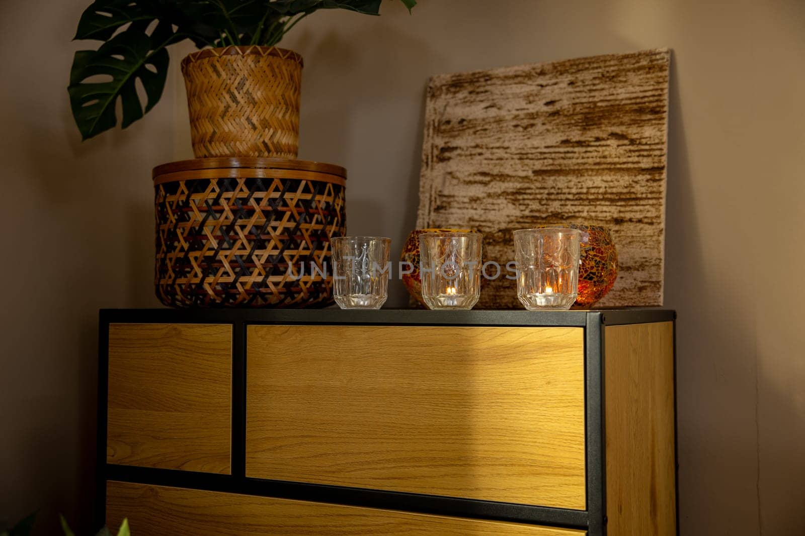 A warm and cozy arrangement that features elegant glassware, natural elements, and modern design aesthetics