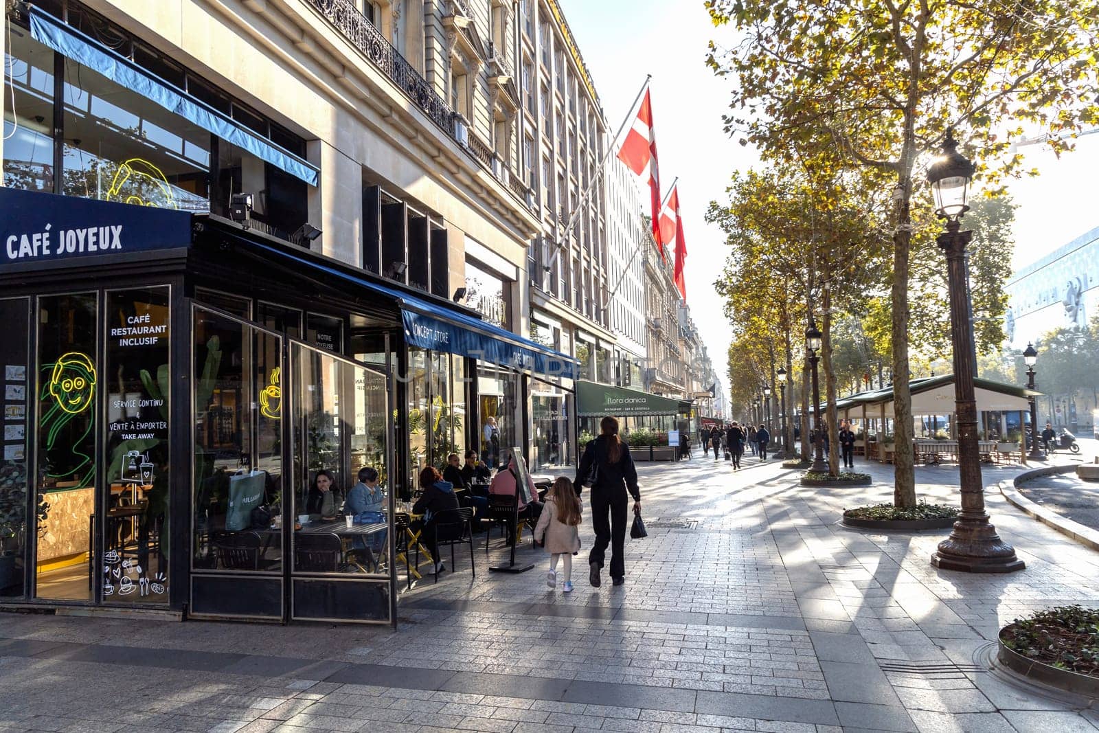 Central street of Paris The Avenue des Champs-Elysees with luxury shops and street life. Paris, France - November 24, 2024
