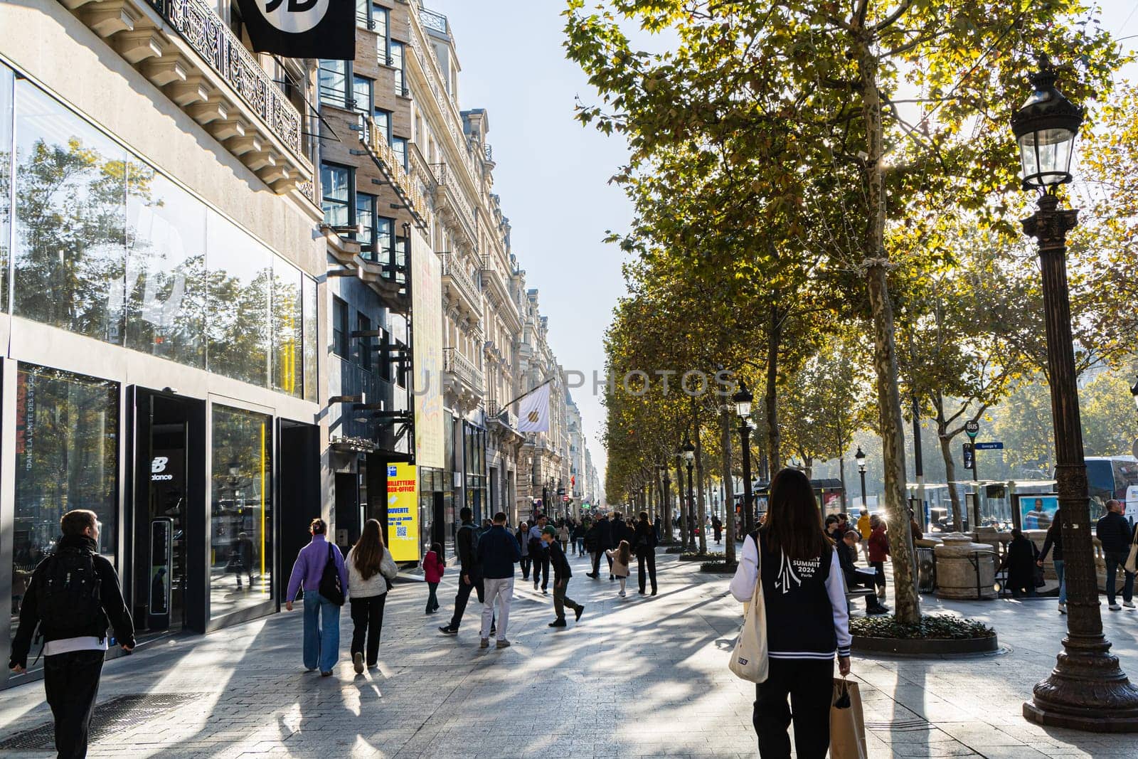 Central street of Paris The Avenue des Champs-Elysees with luxury shops and street life. Paris, France - November 24, 2024
