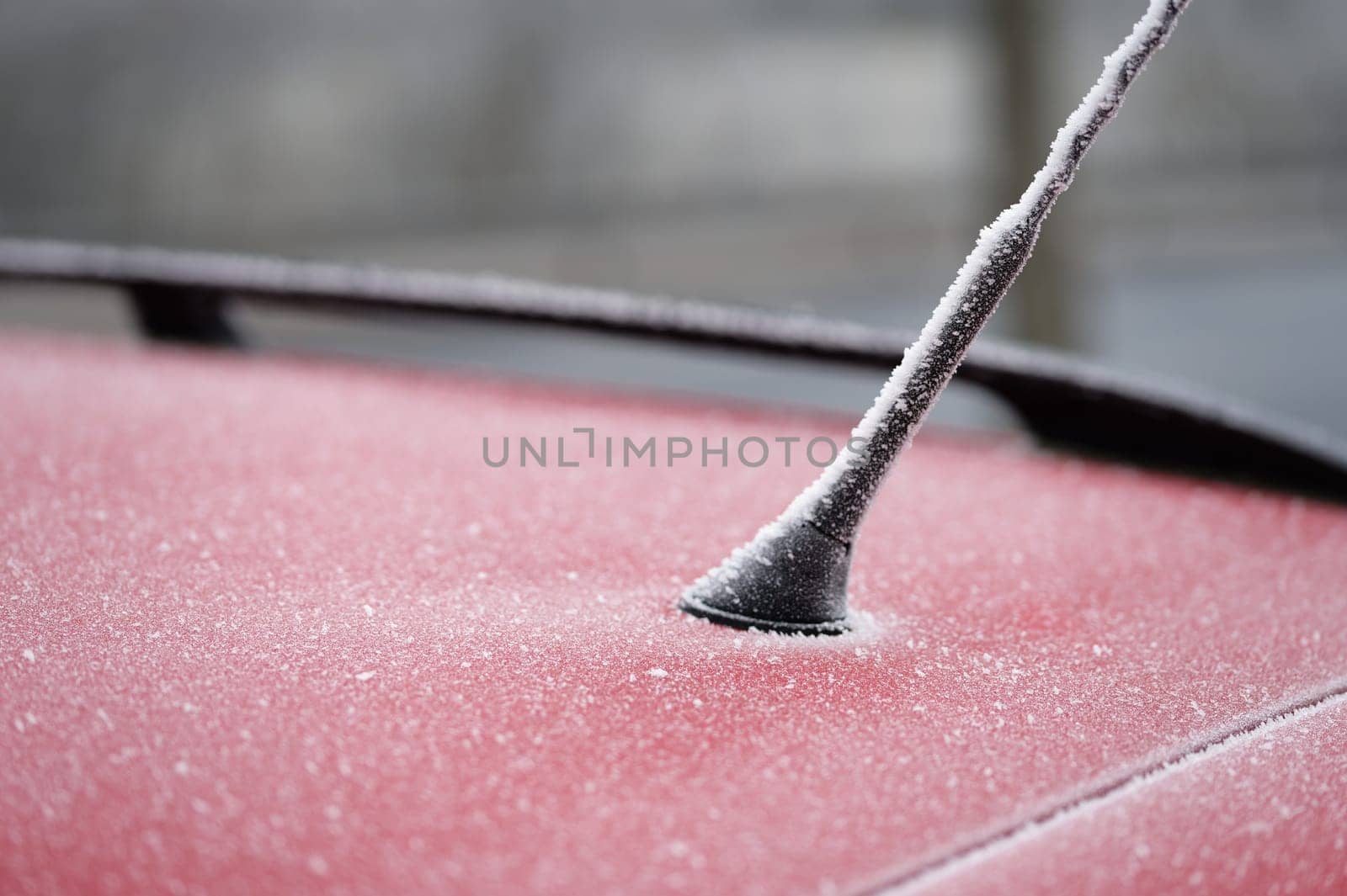 Frozen roof with antenna on car. Concept for winter time and transportation
