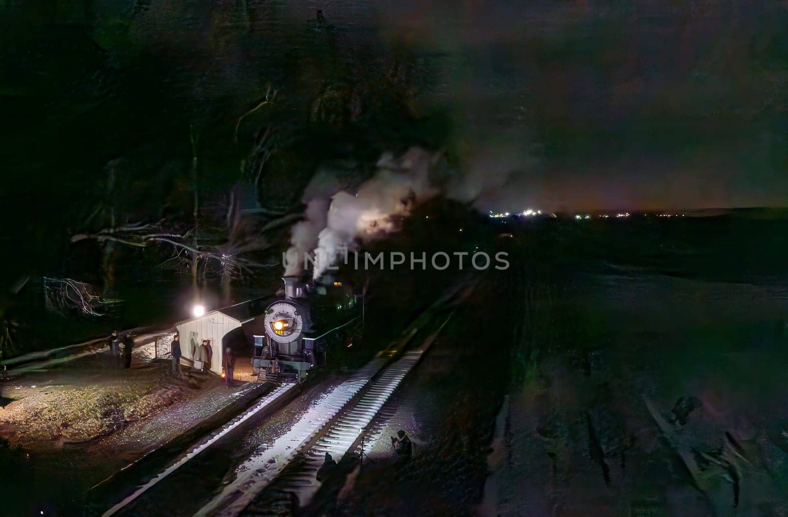 A vintage steam locomotive emits a plume of smoke as it pauses at a quaint station during the night. Soft lights from the station enhance the serene atmosphere, while stars twinkle above.