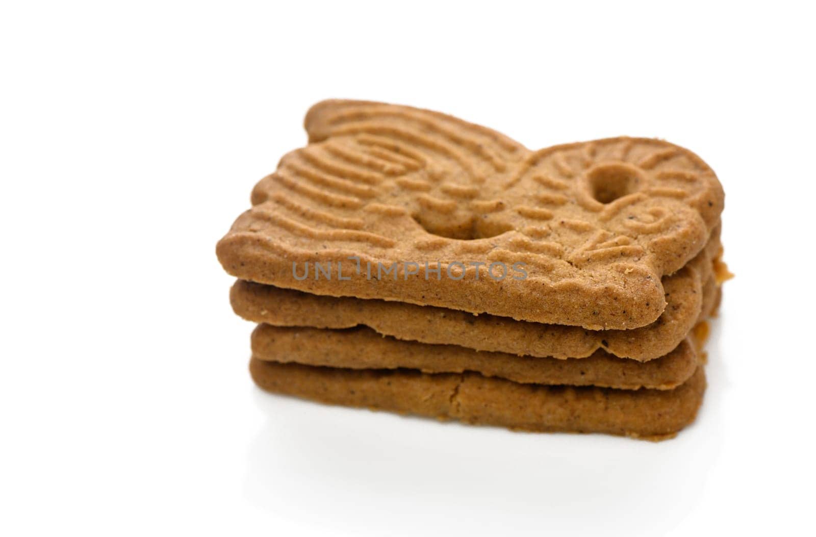 Unique gingerbread cookies stack on a clean white background, inviting you to enjoy their deliciousness.