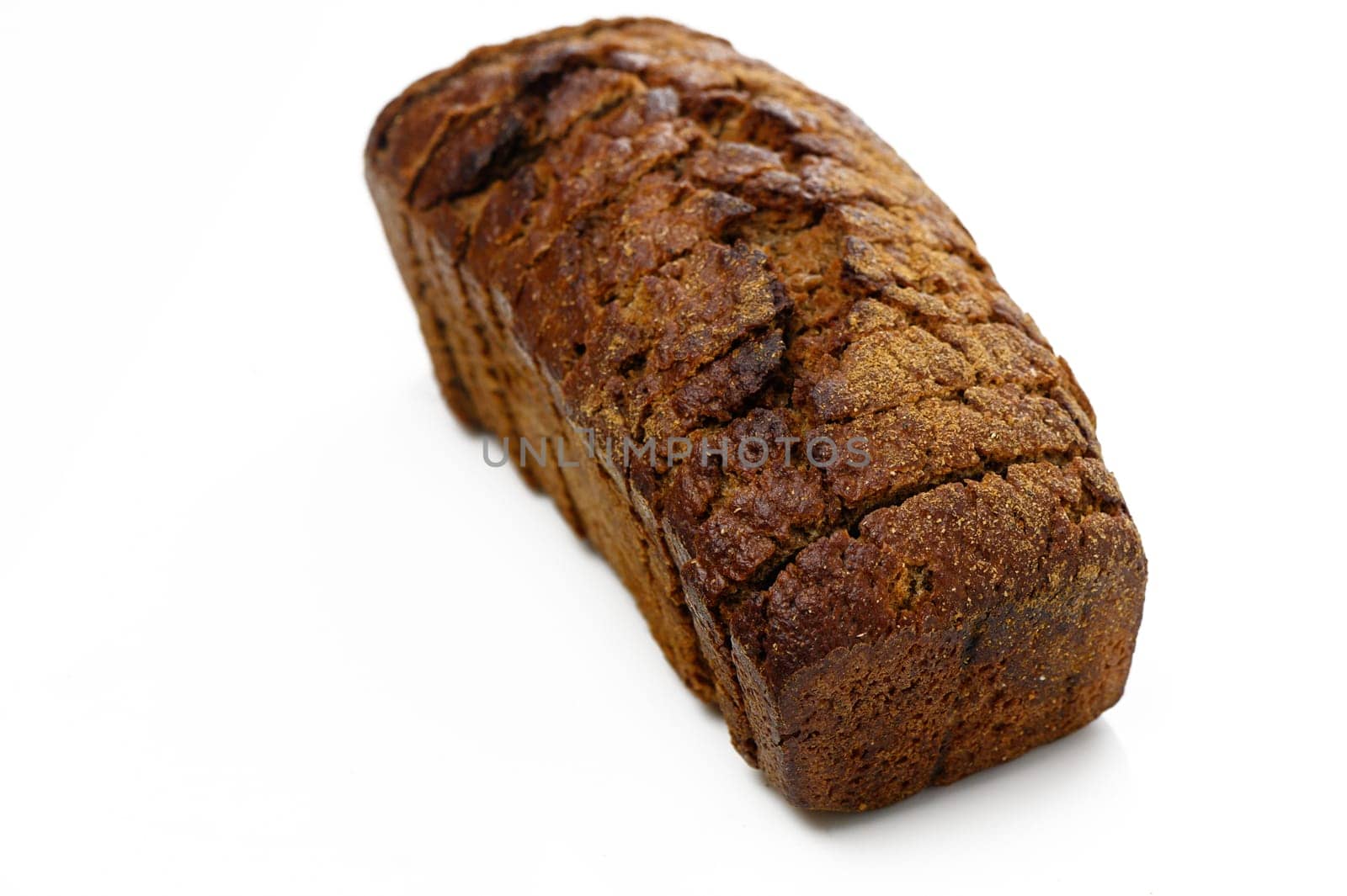 Warm, crusty brown bread cooling on a countertop, showcasing the artisanal craftsmanship of home baking.