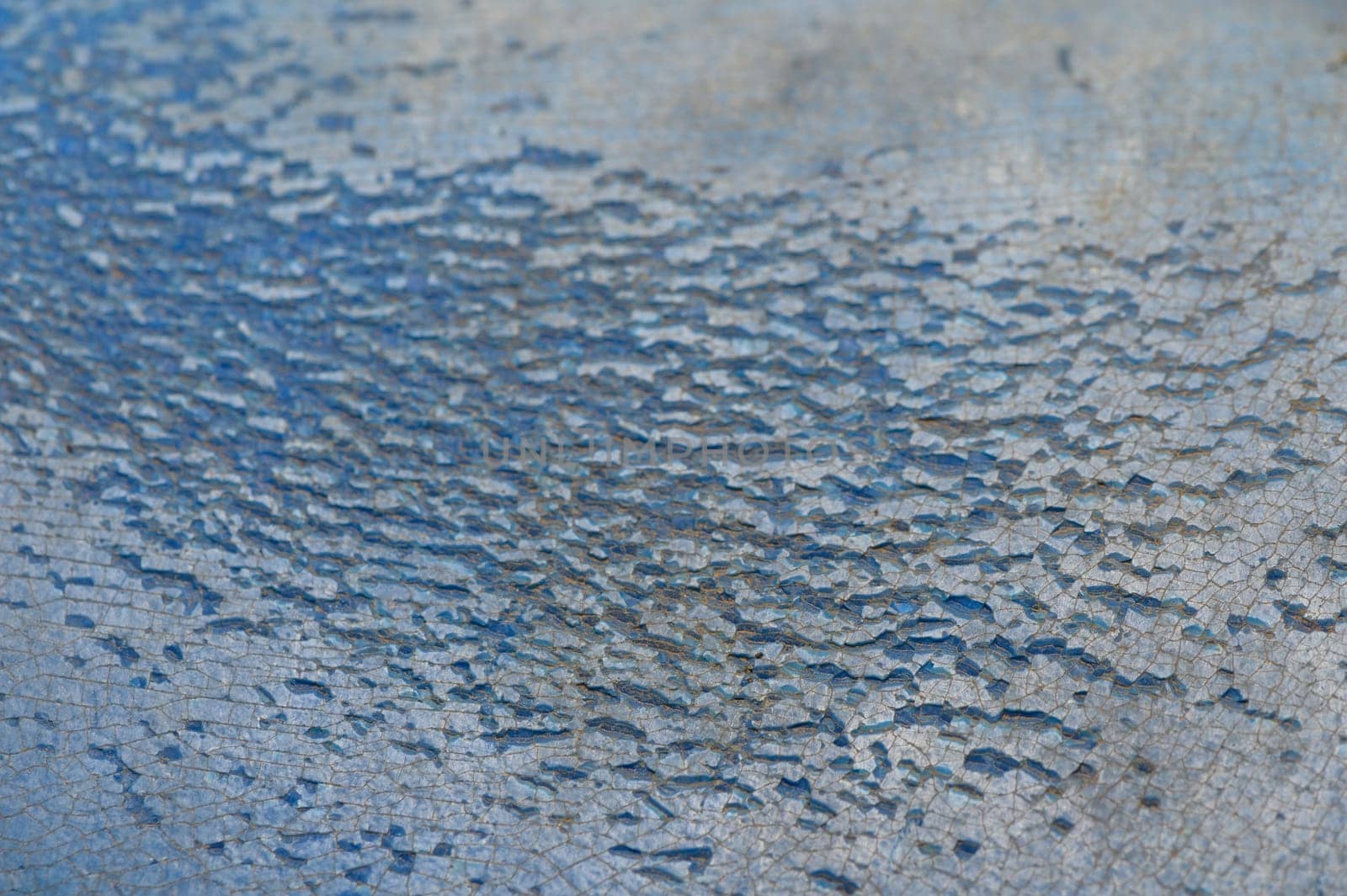 Blue surface exhibits beautiful, delicate cracks, reflecting natural light and creating an enchanting pattern.