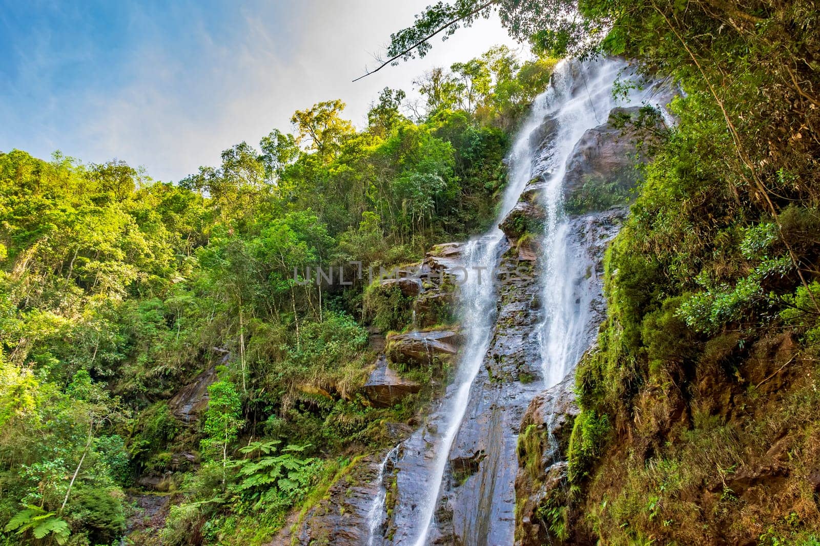 Waterfall among the dense vegetation by Fred_Pinheiro