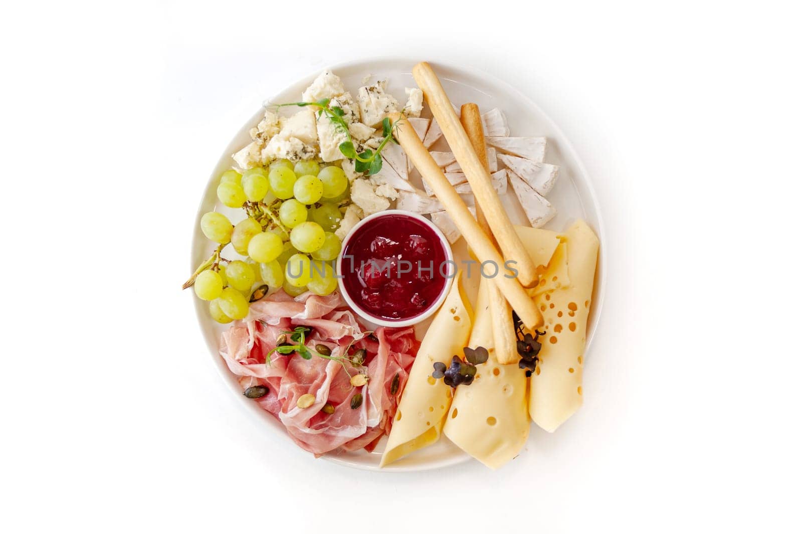 Plate of Mediterranean antipasto snacks. Flat lay, isolated, overhead. High quality photo