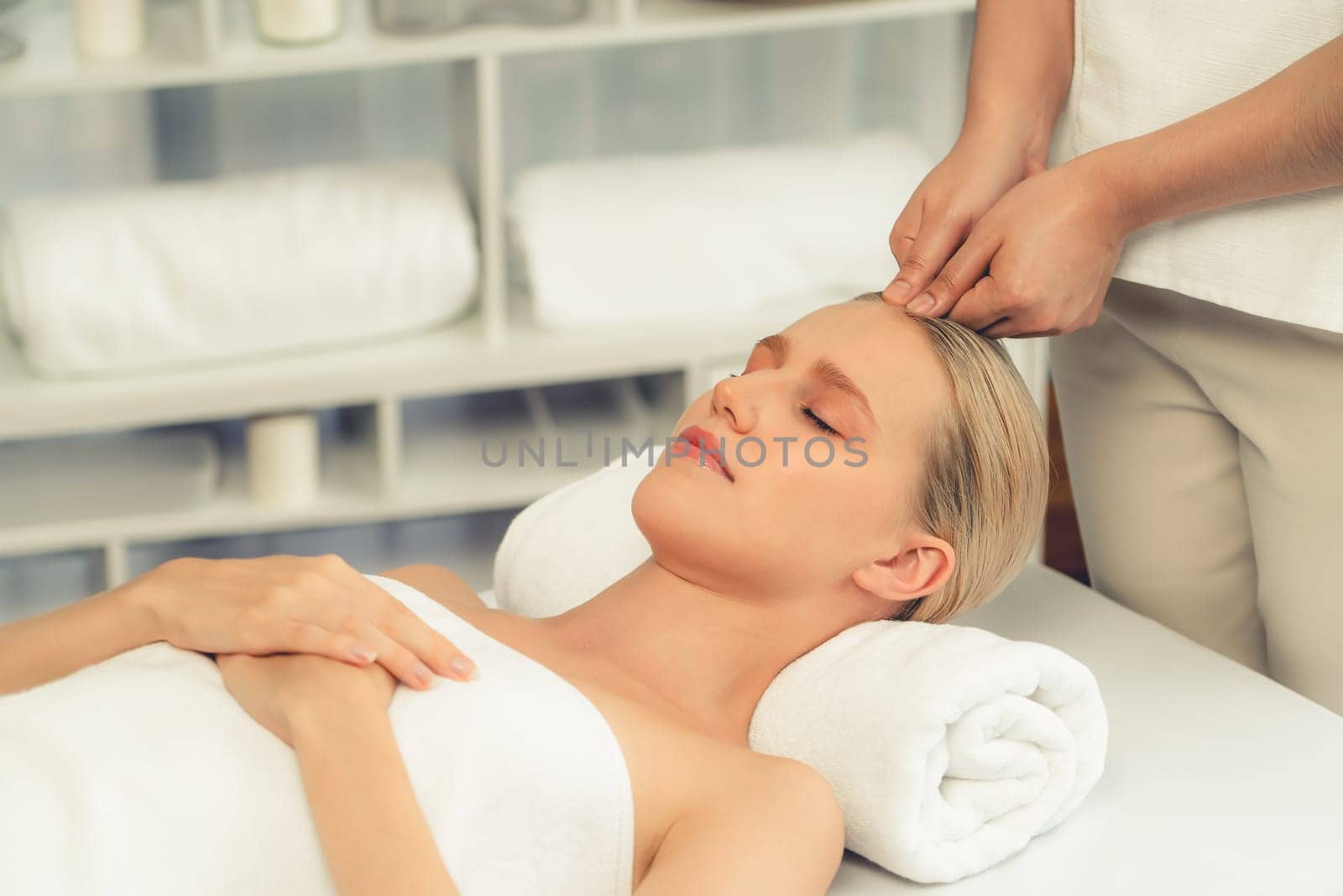 Caucasian woman enjoying relaxing anti-stress head massage. Quiescent by biancoblue