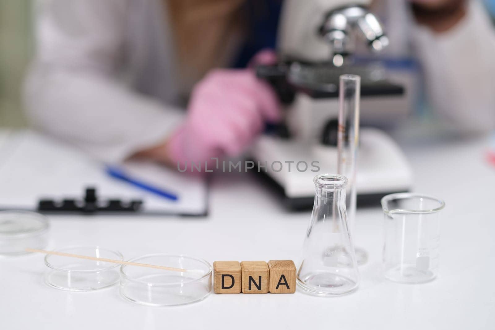 A wellequipped laboratory setting where DNA analysis is performed using advanced microscopes and various glassware