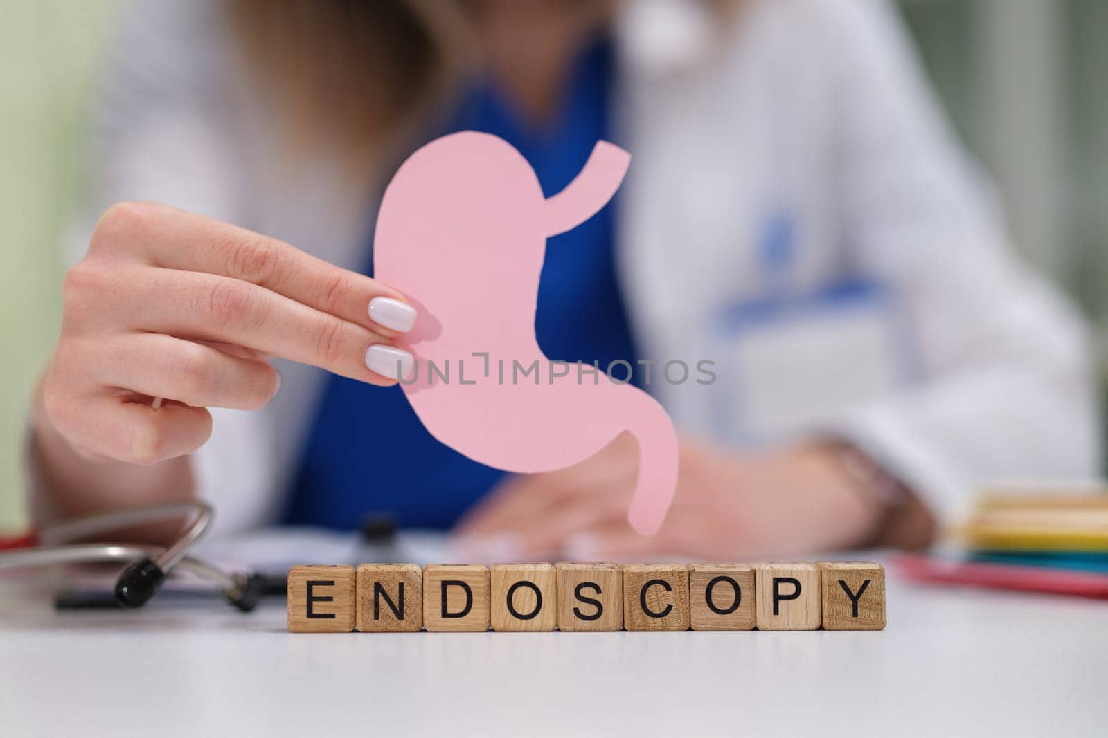 This visual representation of endoscopy includes a detailed stomach illustration for health education