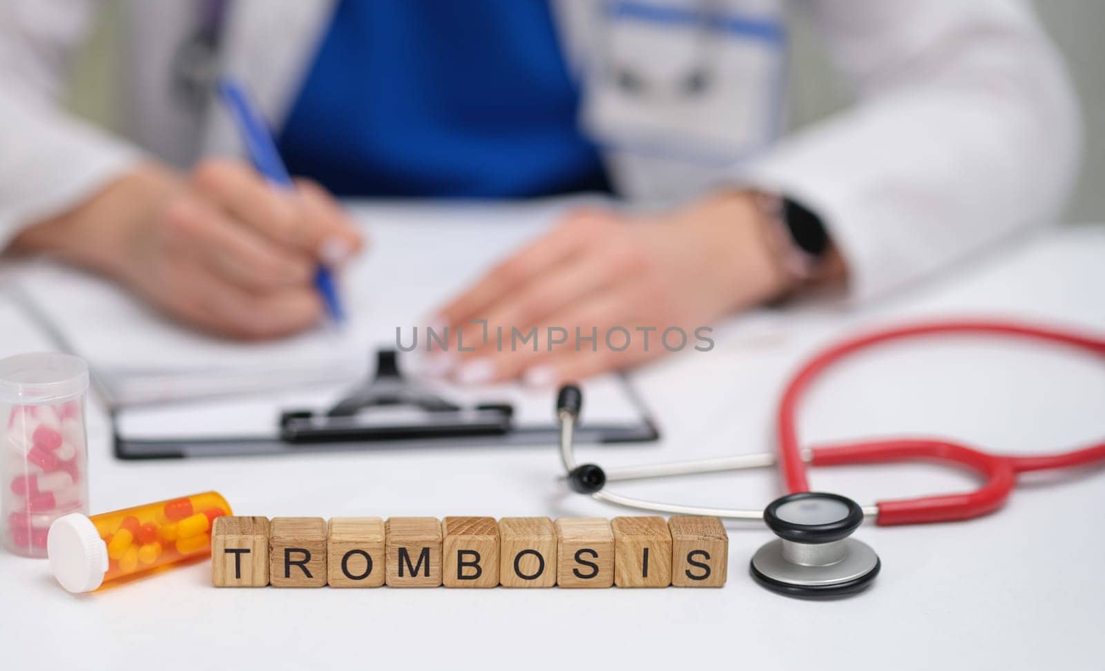An organized healthcare professionals desk showcasing thrombosisrelated items, materials, and notes present