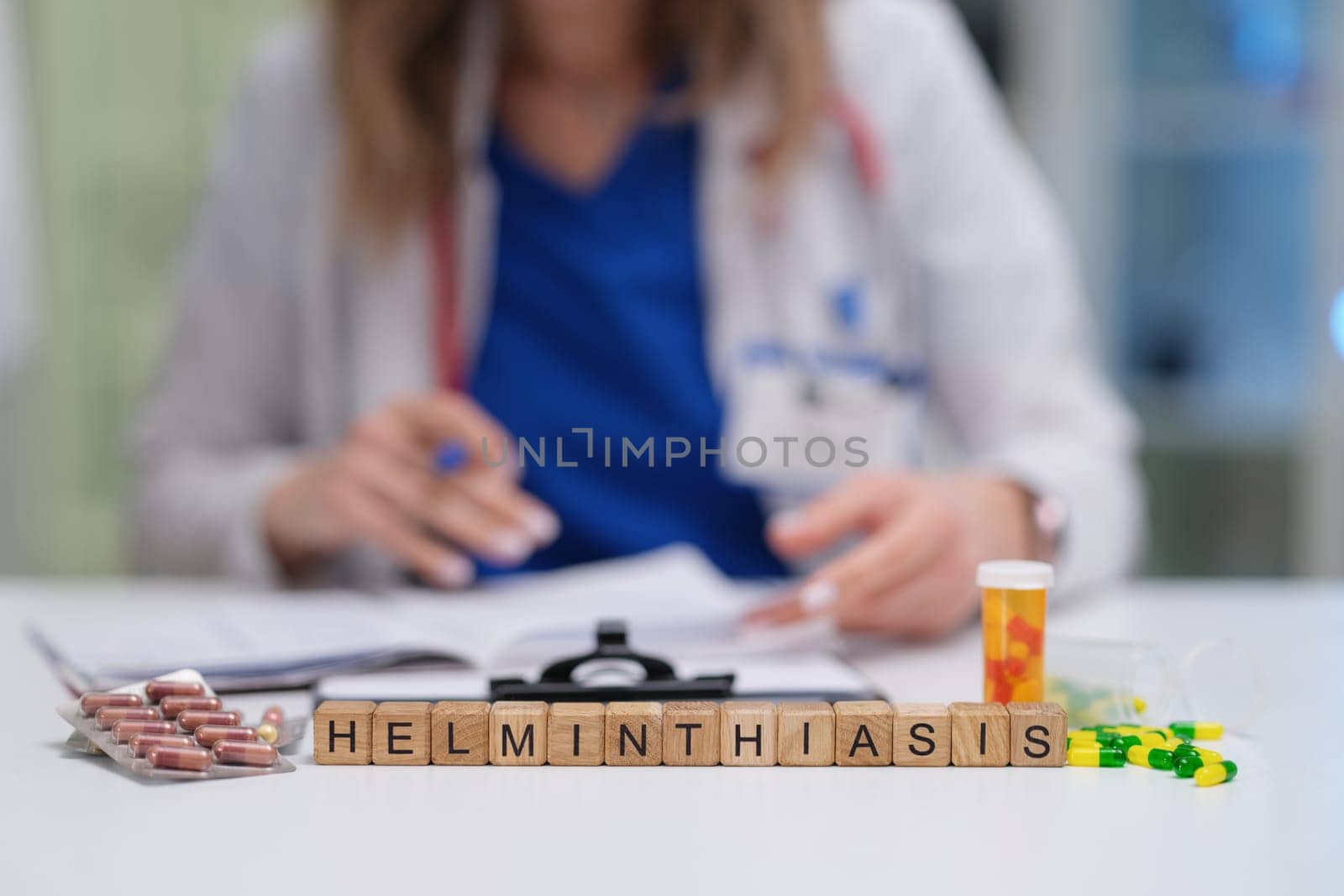 A medical professional is carefully reviewing various treatment options and medications available for helminthiasis