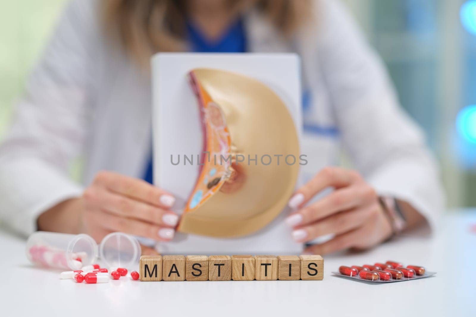 This educational visual presentation on mastitis includes an anatomical model and medication representation