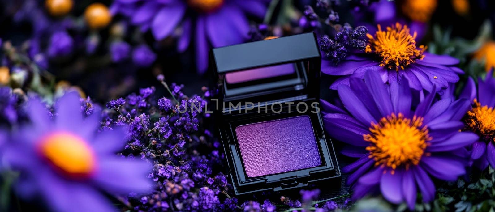 Purple makeup palette amidst vibrant flowers with lush petals and blossoms.