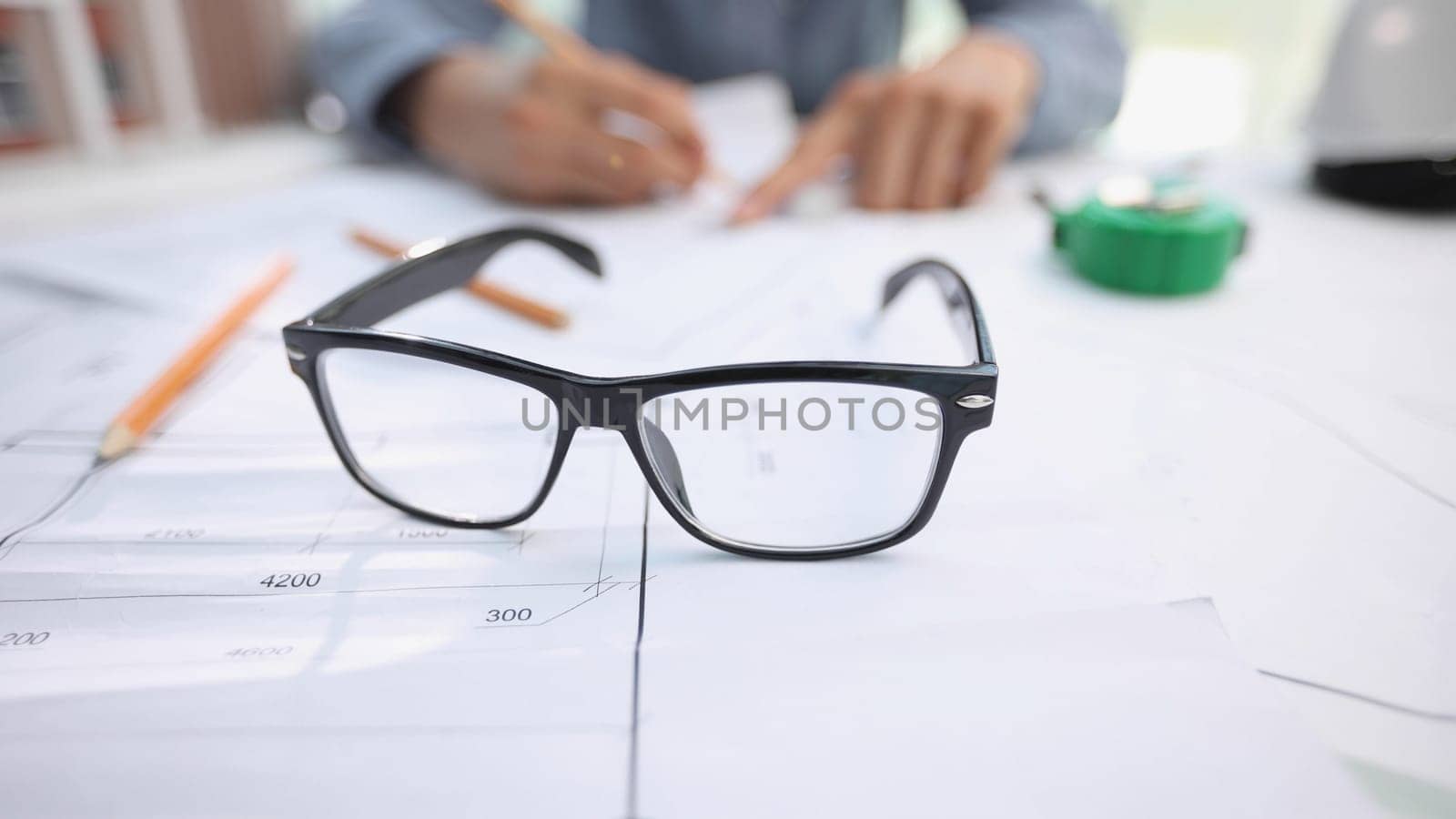 glasses on a construction drawing in the office