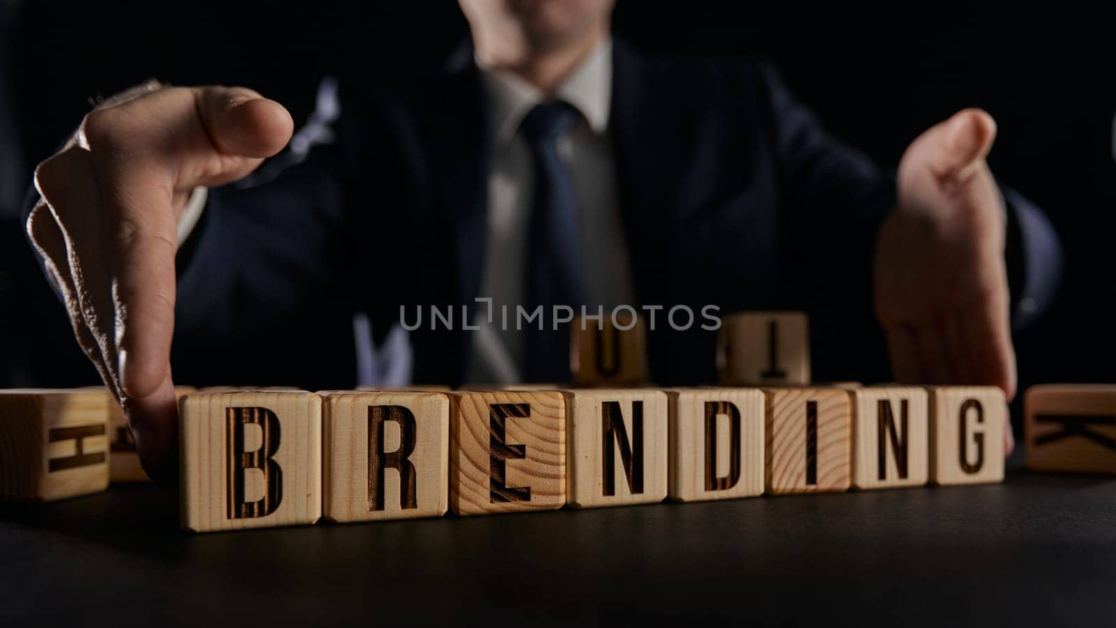 businessman hands holding cubes with branding word