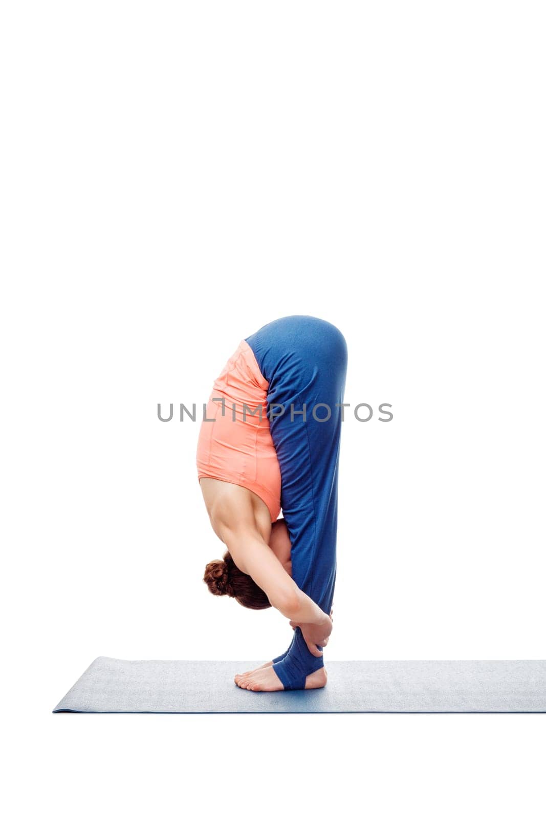 Woman doing Ashtanga Vinyasa Yoga Surya Namaskar Sun Salutation asana uttanasana - standing forward bend pose posture isolated on white background