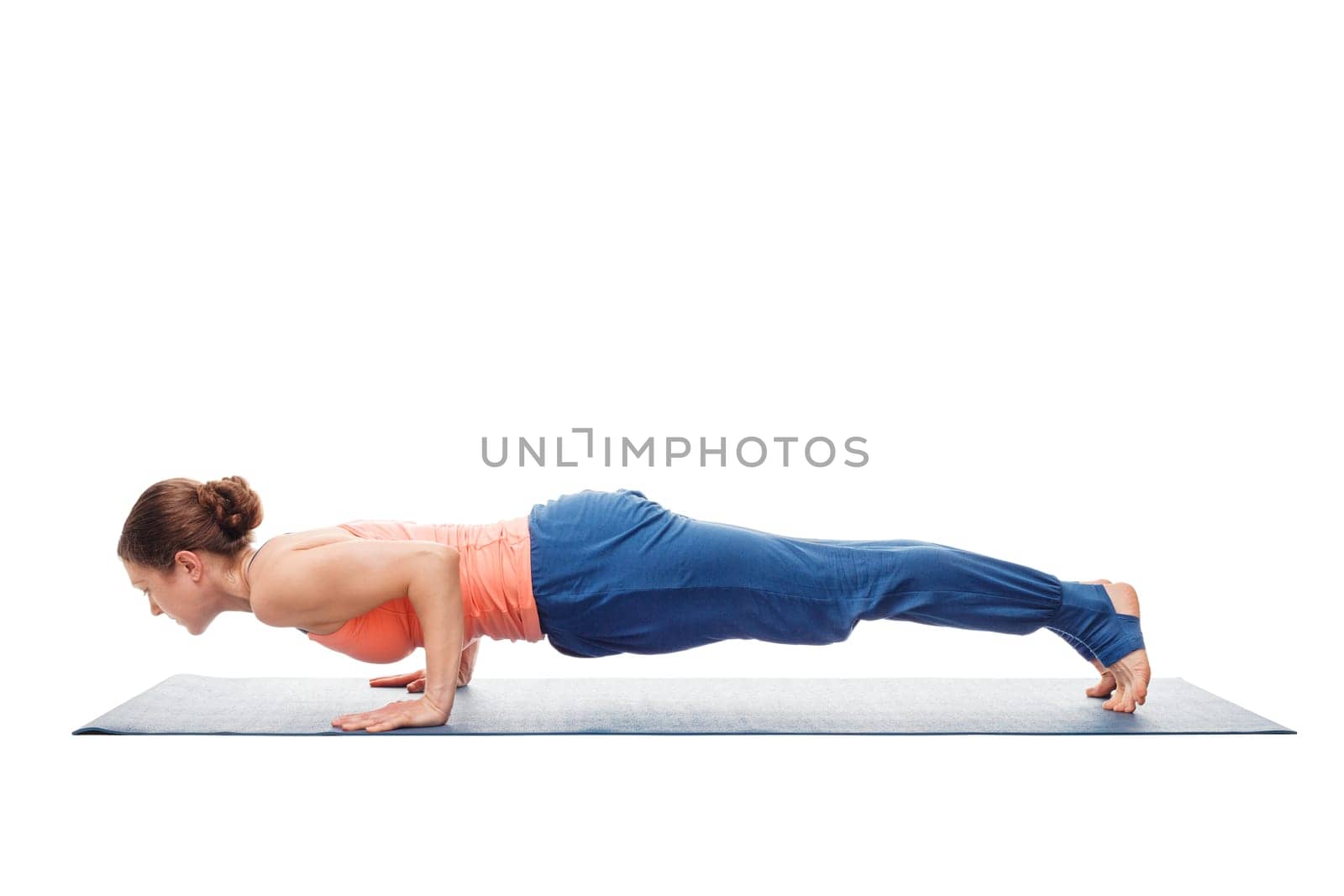 Woman doing Ashtanga Vinyasa Yoga asana Chaturanga Dandasana - four-limbed staff pose posture isolated on white background