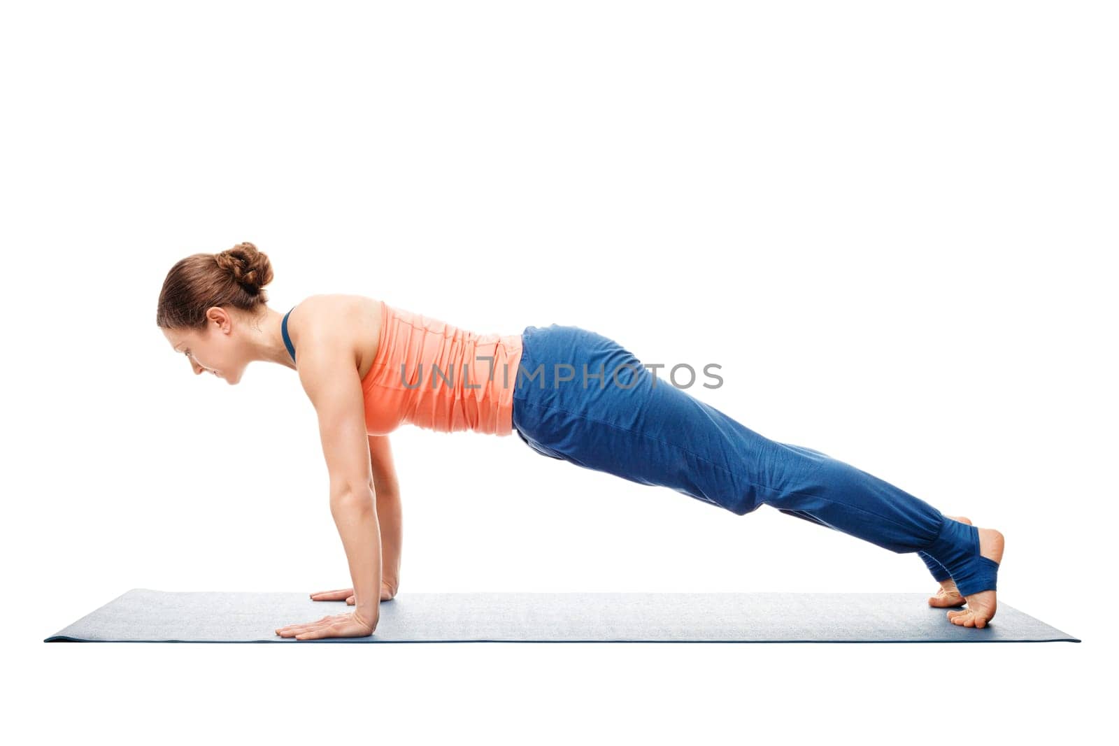 Woman doing yoga asana Utthita chaturanga dandasana (or phalakasana) - extended four-limbed posture plank pose isolated on white background