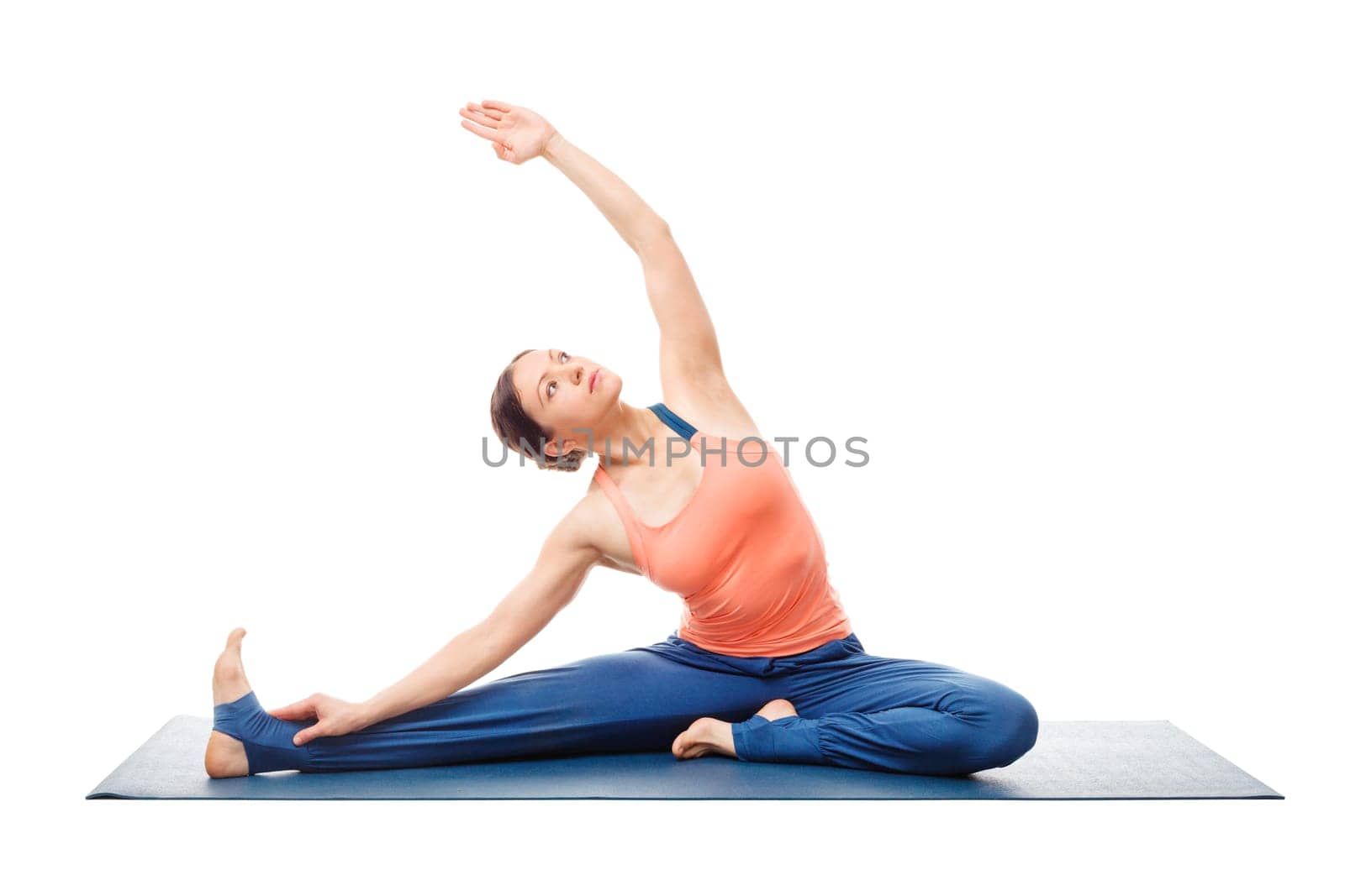 Beautiful sporty fit yogini woman practices yoga asana parivrtta janu sirsasana - revolved head-to-knee pose beginner easy posture variation isolated on white background