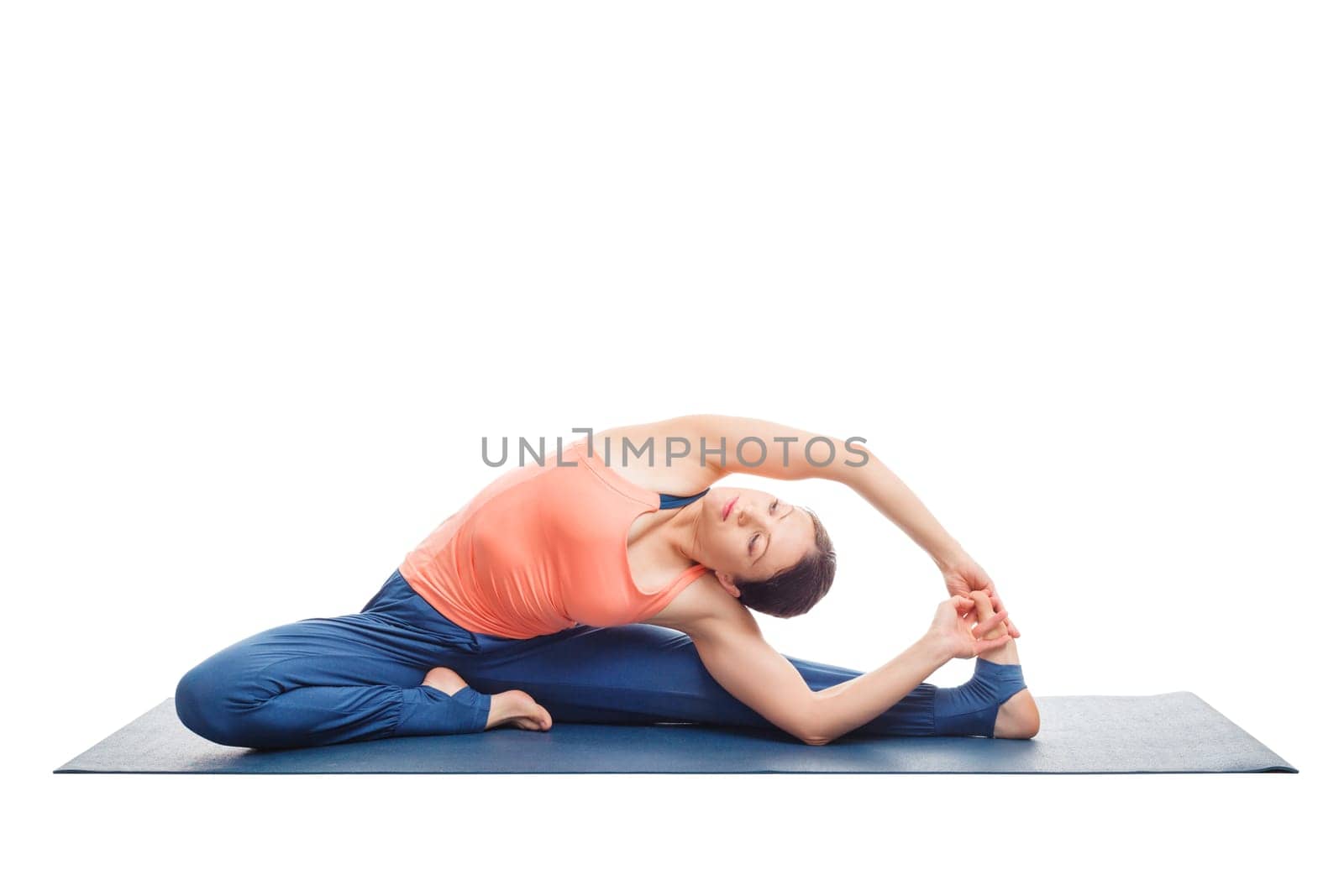 Beautiful sporty fit yogini woman practices yoga asana parivrtta janu sirsasana - revolved head-to-knee pose isolated on white background