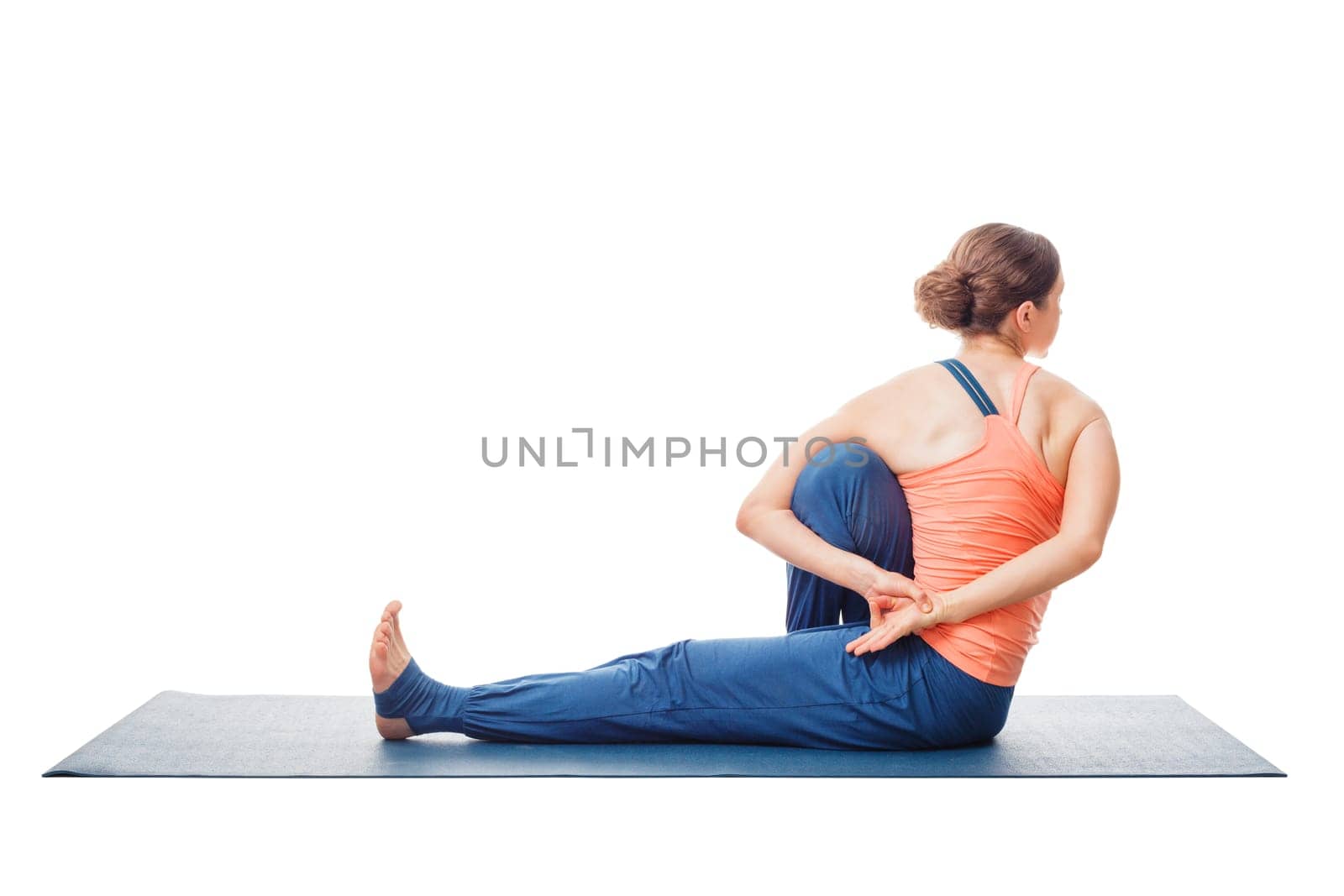 Woman doing Ashtanga Vinyasa Yoga stretching asana Marichyasana C - pose posture dedicated to sage Marichi on white background