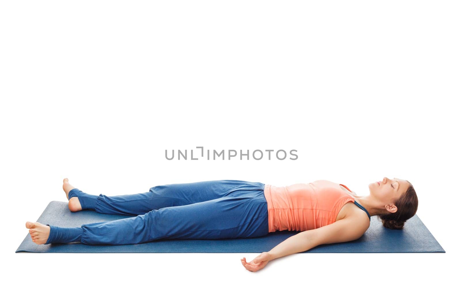 Woman relaxes in yoga asana Savasana - corpse pose isolated on white