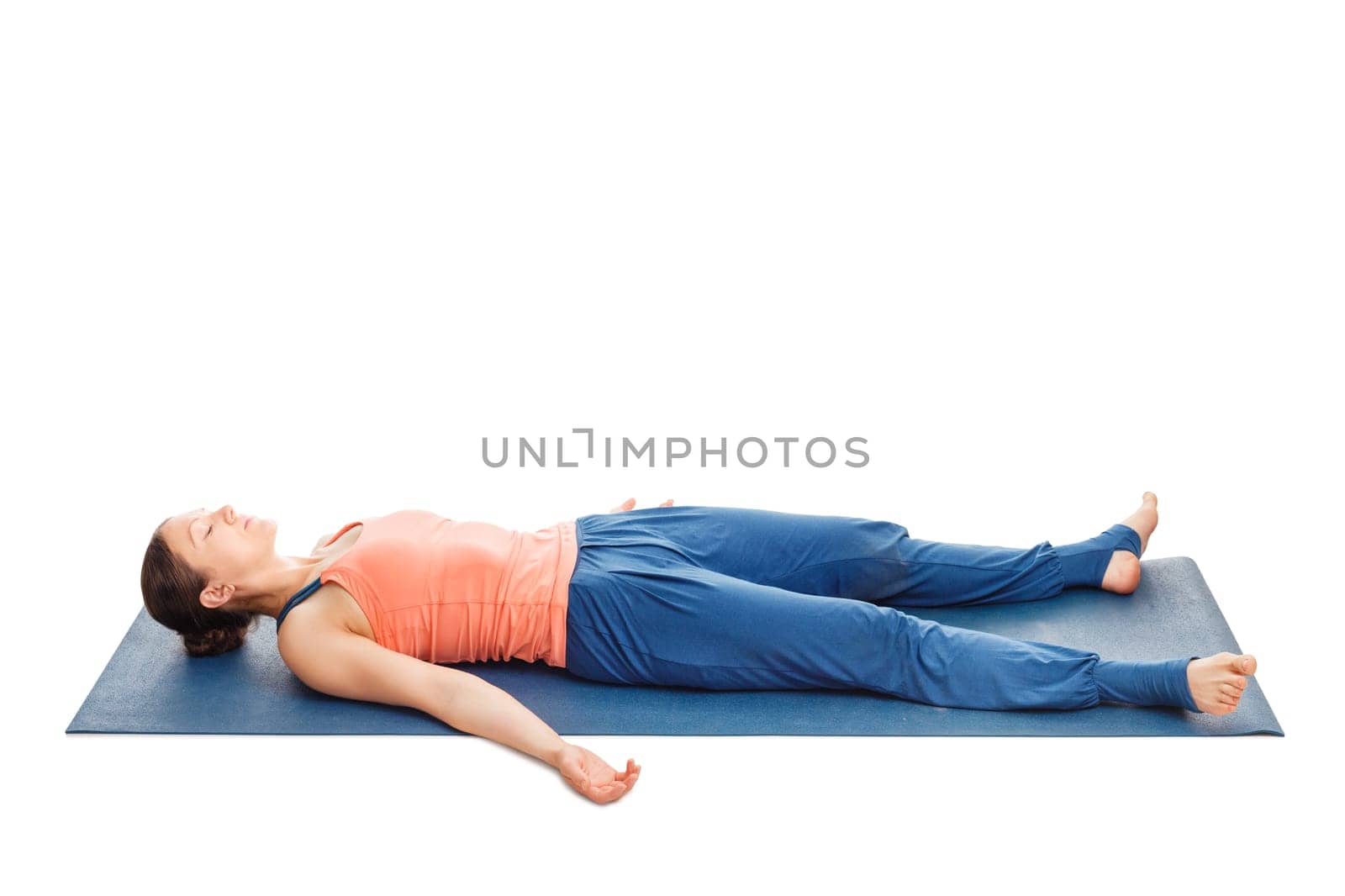 Woman relaxes in yoga asana Savasana - corpse pose isolated on white