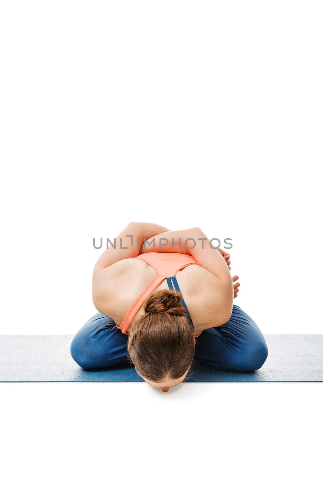 Woman doing asana Yoga mudrasana by dimol