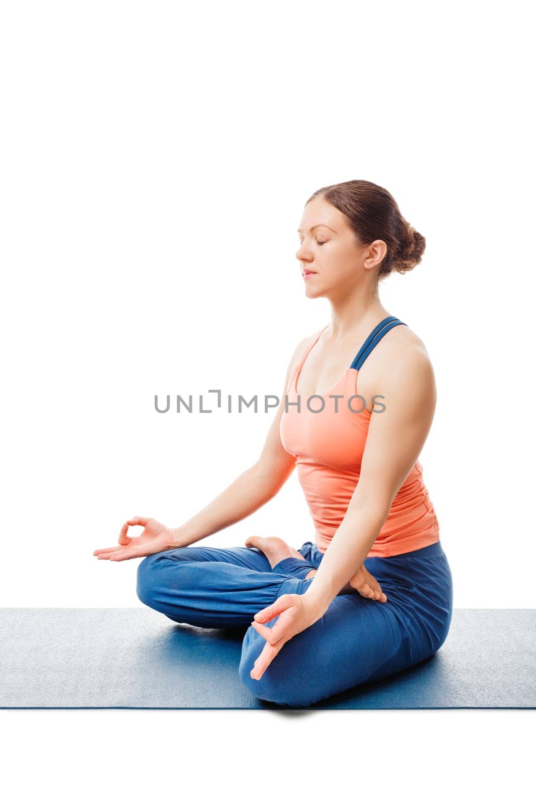 Woman doing Yoga meditation asana Padmasana - lotus pose posture with chin mudra isolated on white background