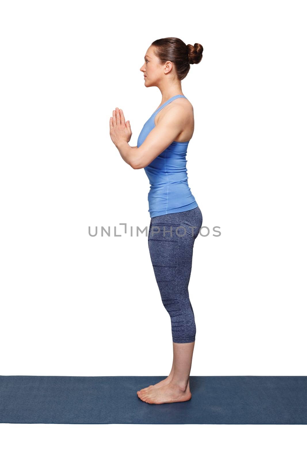 Woman doing Hatha Yoga asana Tadasana namaste -Mountain pose with salutation isolated