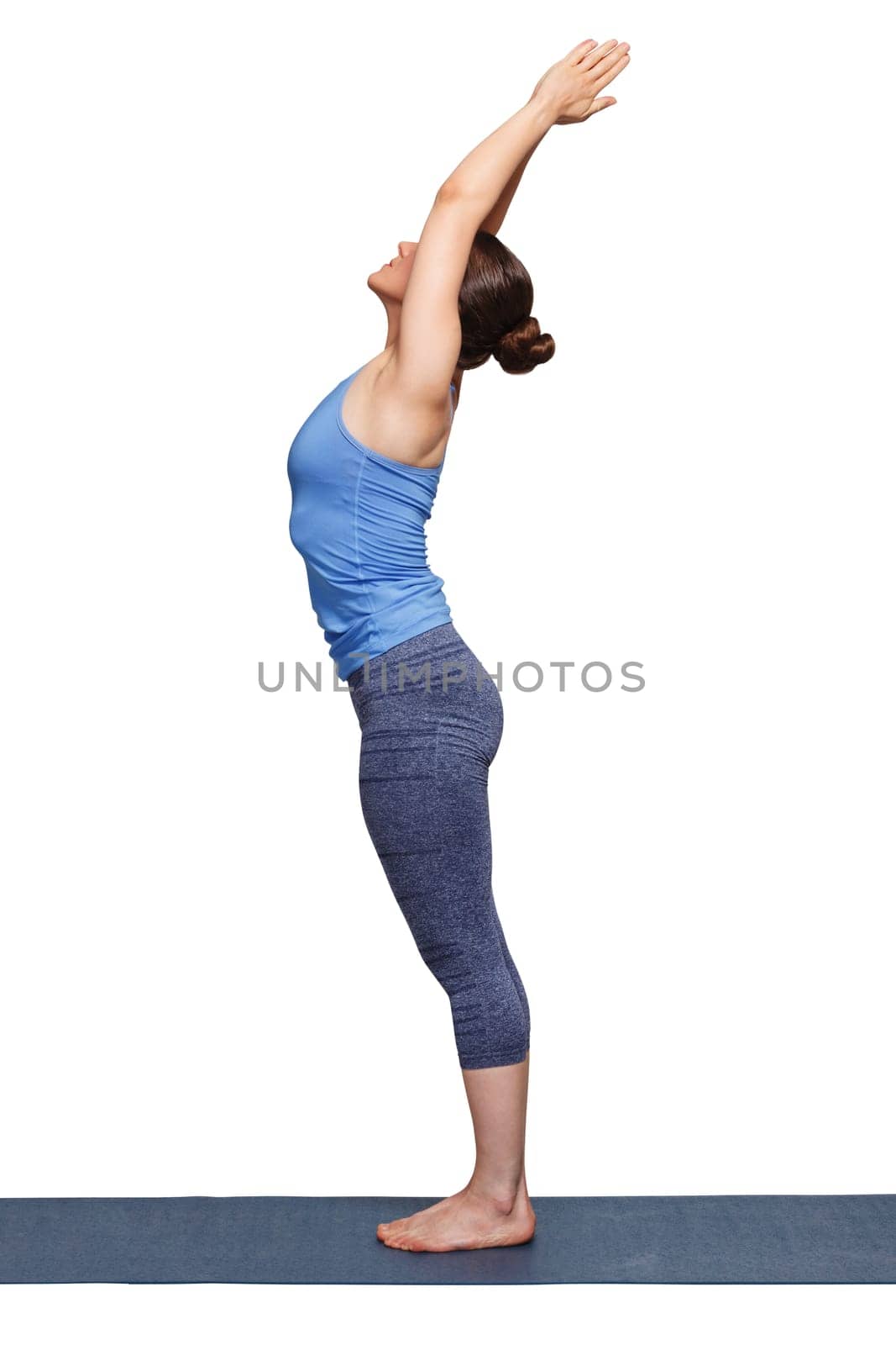 Woman doing Hatha Yoga asana Tadasana by dimol