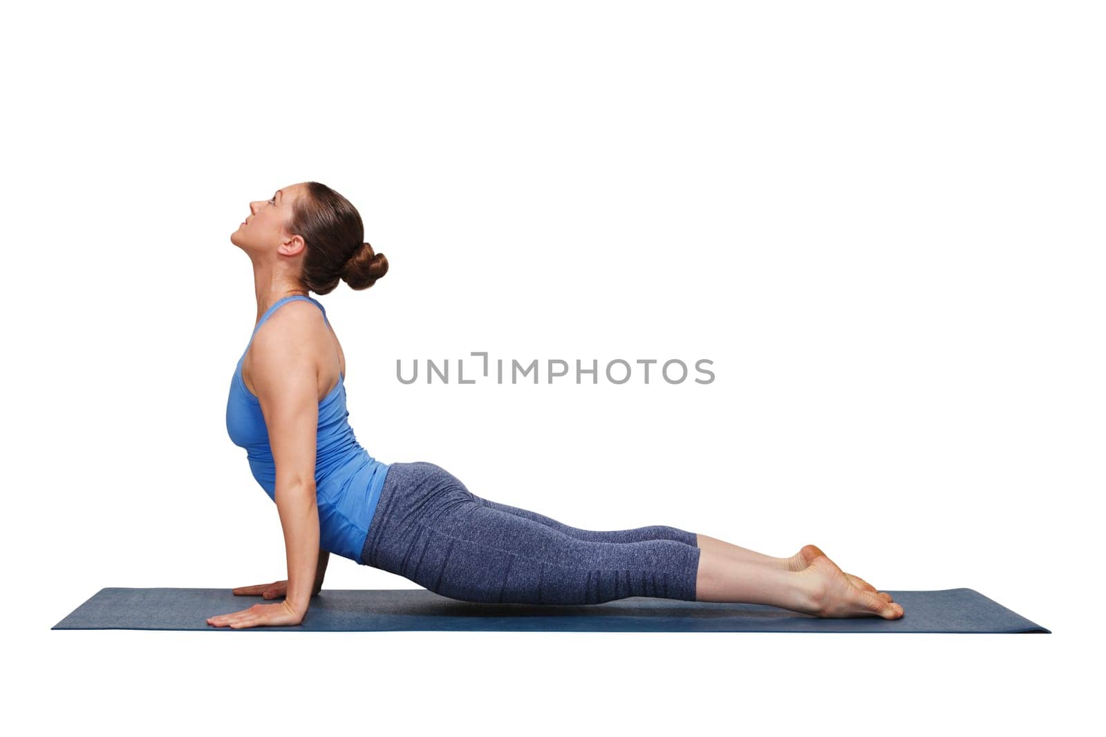 Woman doing Ashtanga Vinyasa yoga asana Urdhva mukha svanasana by dimol