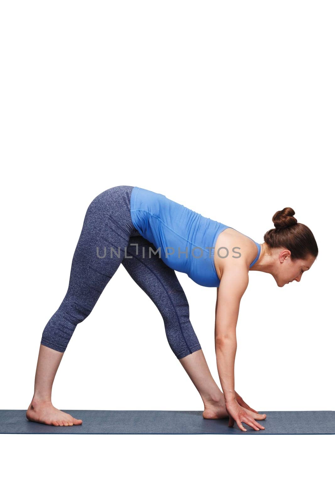 Woman doing Ashtanga Vinyasa yoga asana Parsvottanasana - intense side stretch pose on yoga mat isolated on white background