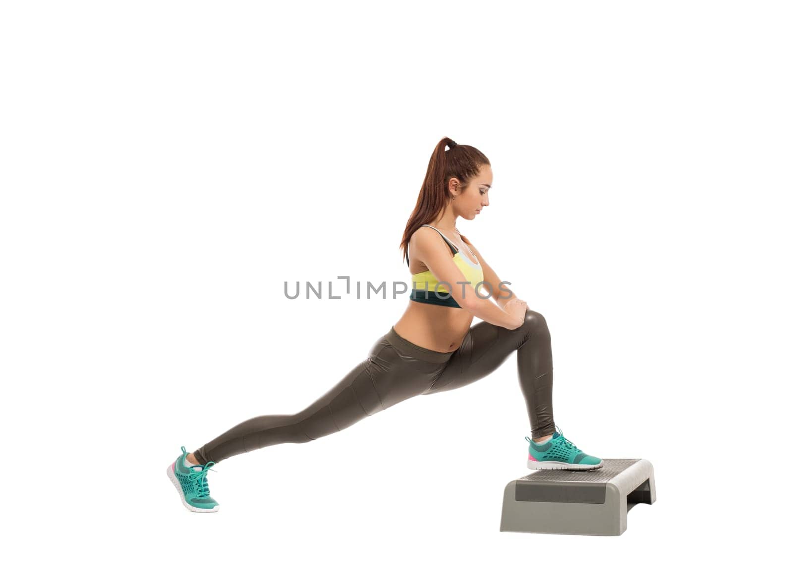 Image of attractive athletic girl exercising on stepper