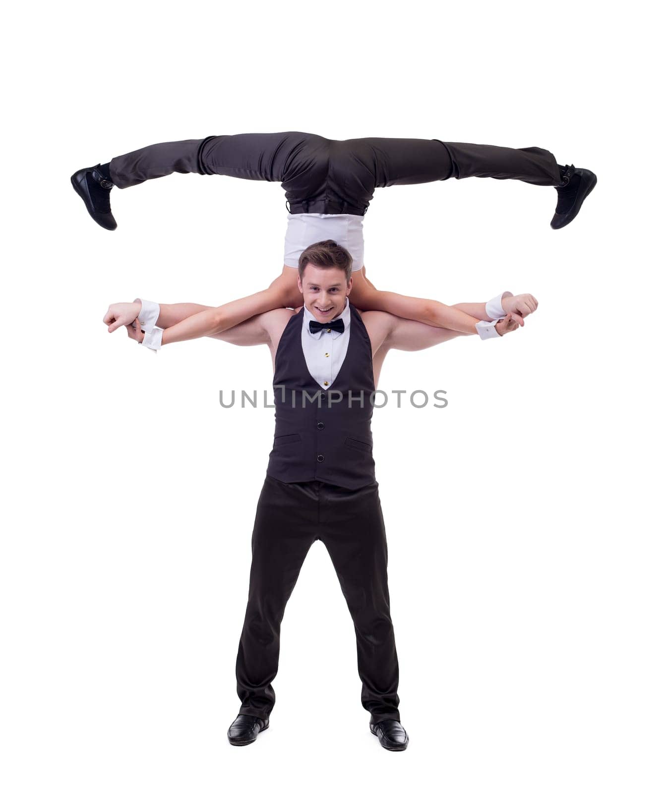 Cheerful male dancer holds on shoulders of his partner, isolated on white