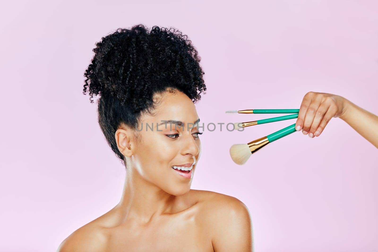 Makeup brush, happy and studio face of woman with tools for skincare glow, foundation product or wellness treatment. Beauty spa cosmetics, facial cosmetology and dermatology person on pink background by YuriArcurs