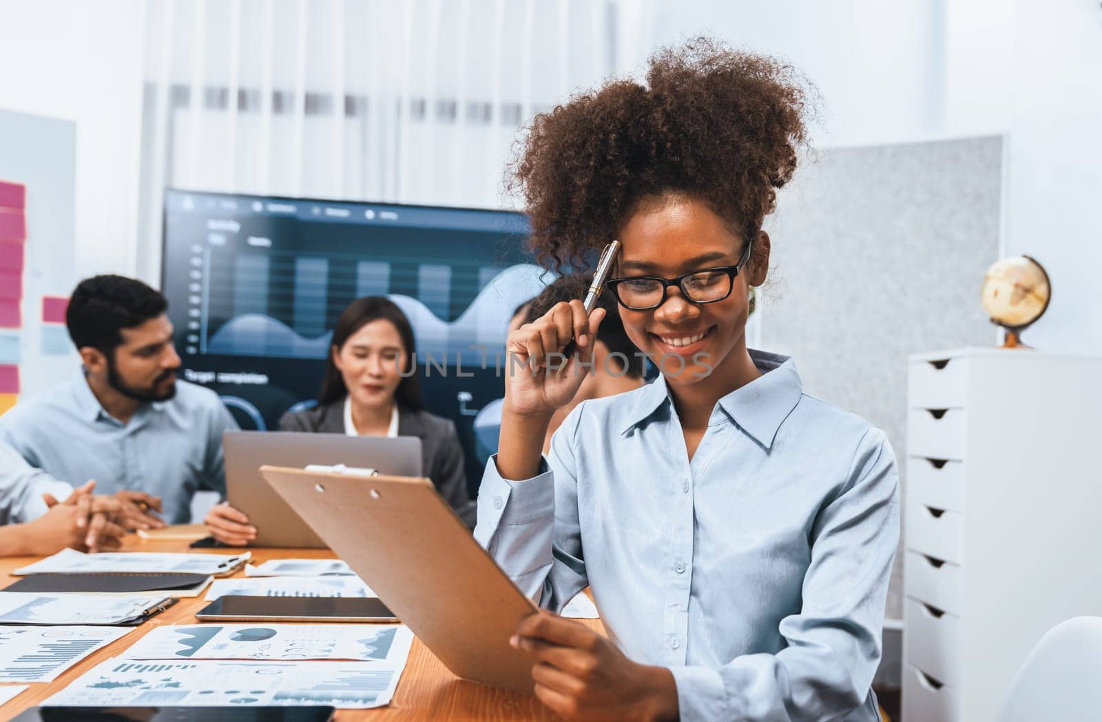 Portrait of happy young african businesswoman with in office meeting. Concord by biancoblue