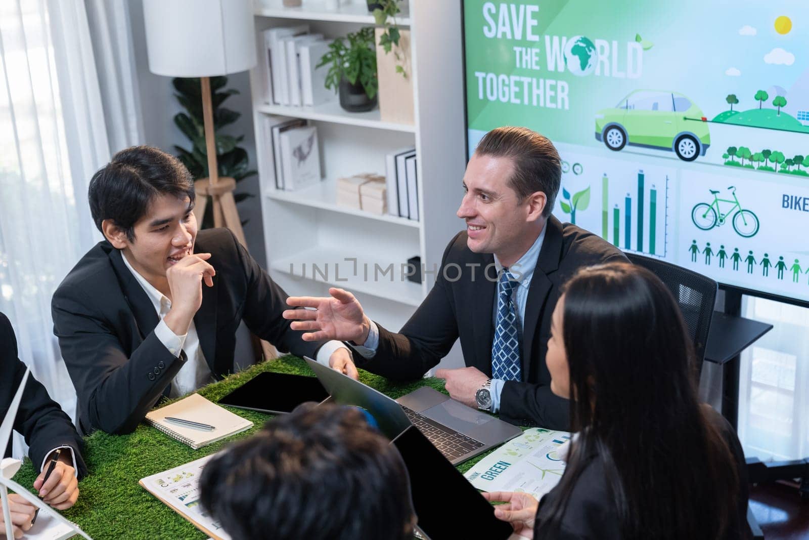 Diverse group of business people planning business marketing investment with eco-friendly policy for greener ecology. Productive teamwork contribute natural preservation and sustainable future. Quaint