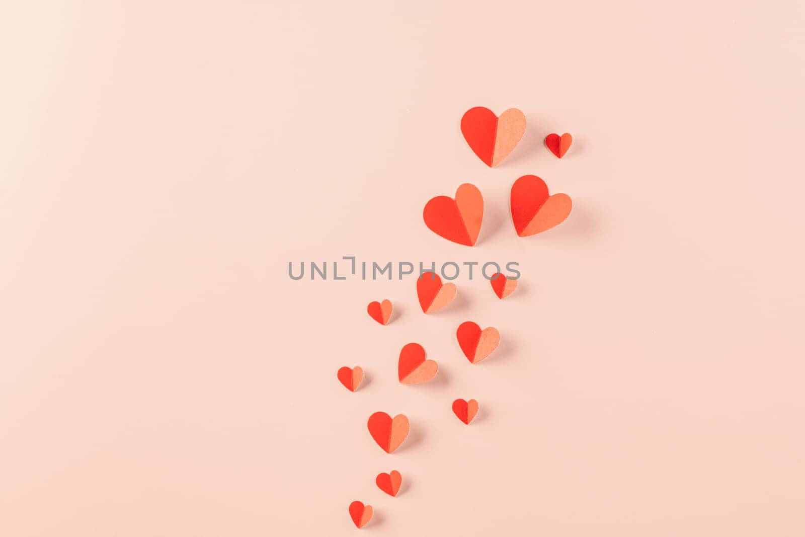 Happy Valentine Day concept, red paper hearts shape cutting isolated pastel pink background, Happy mother day, Symbol of love paper art elements with place for text, Banner design greeting card