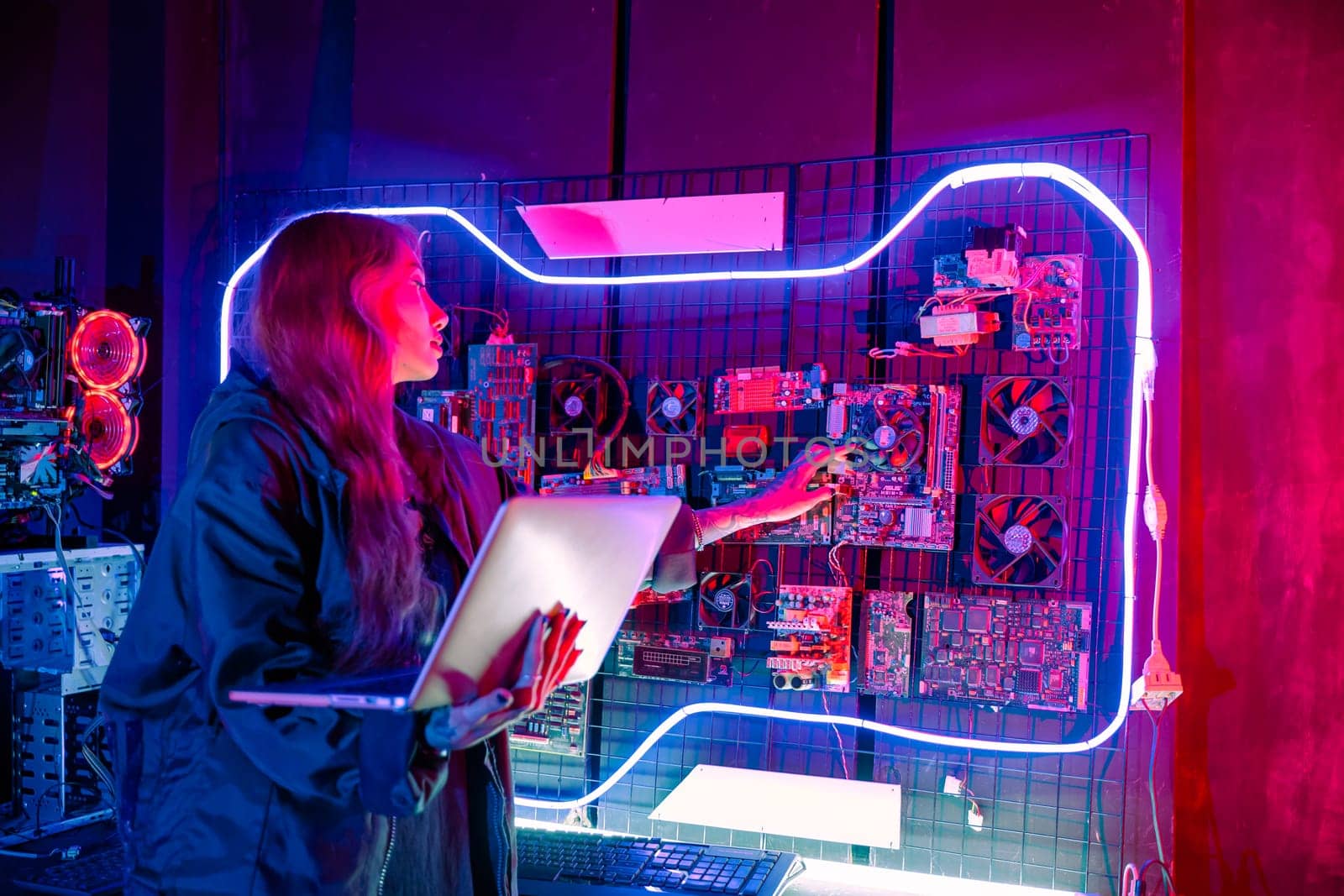 Software engineer typing coding in laptop computer at data center, Hacker woman is sitting at a desk with a laptop service in server room, Thinking and solve problems, Cyber security