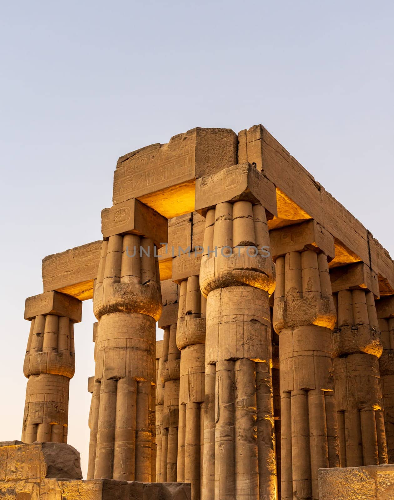 Massive numerous stone columns supporting roof of Luxor Temple in Egypt