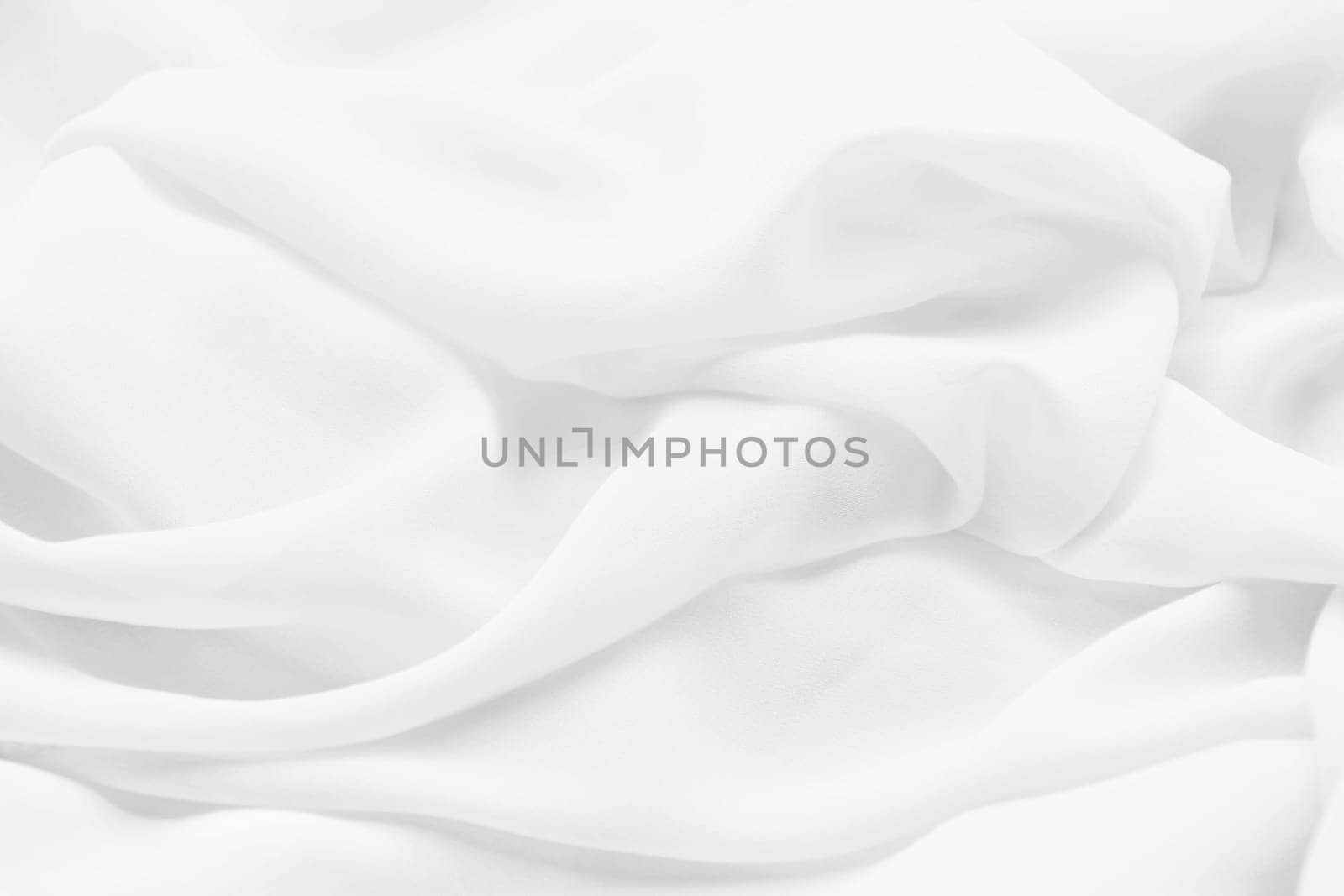 Weißer Hintergrund. Nahaufnahme von einem weichen weißen Stoff