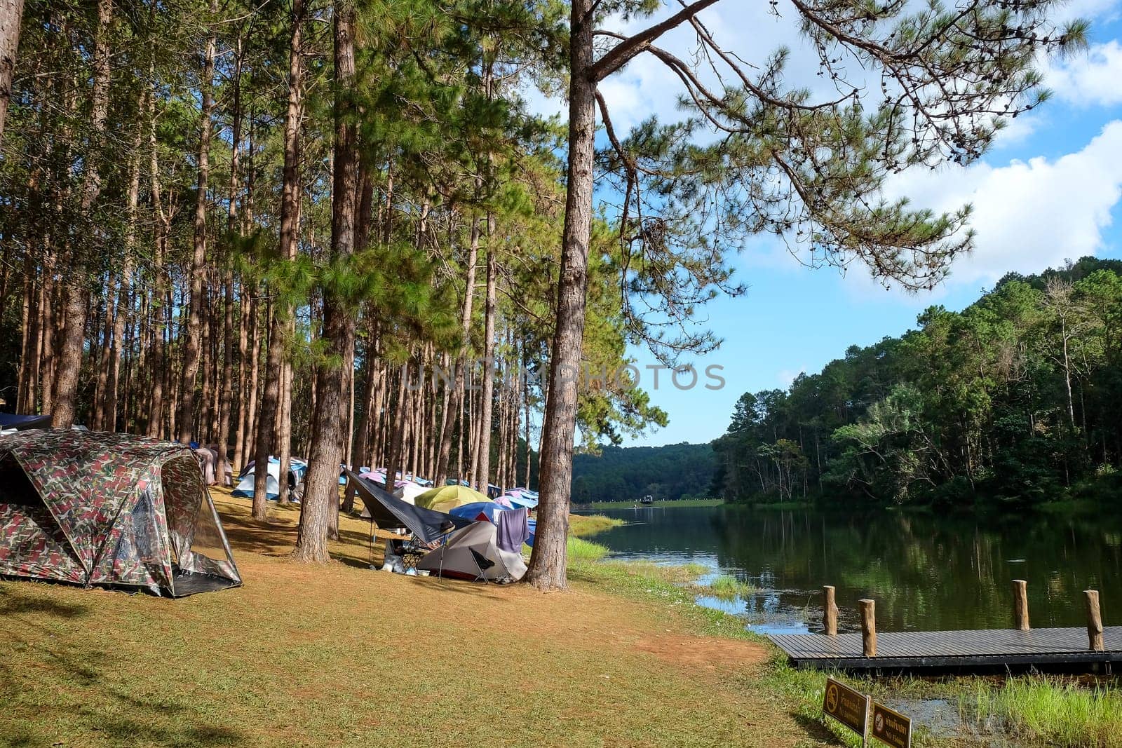 Camping on the lake in the pine forest at Pang Tong Under Royal Forest Park ( Pang Ung ), Mae Hong Son, Thailand. Pang Ung is a popular place to stay in a camping in the winter.