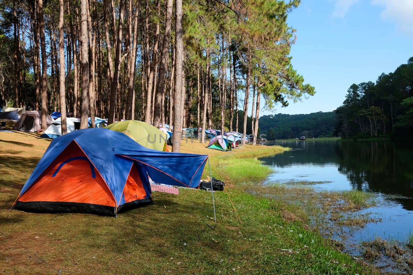 Camping on the lake in the pine forest at Pang Tong Under Royal Forest Park ( Pang Ung ), Mae Hong Son, Thailand. Pang Ung is a popular place to stay in a camping in the winter.