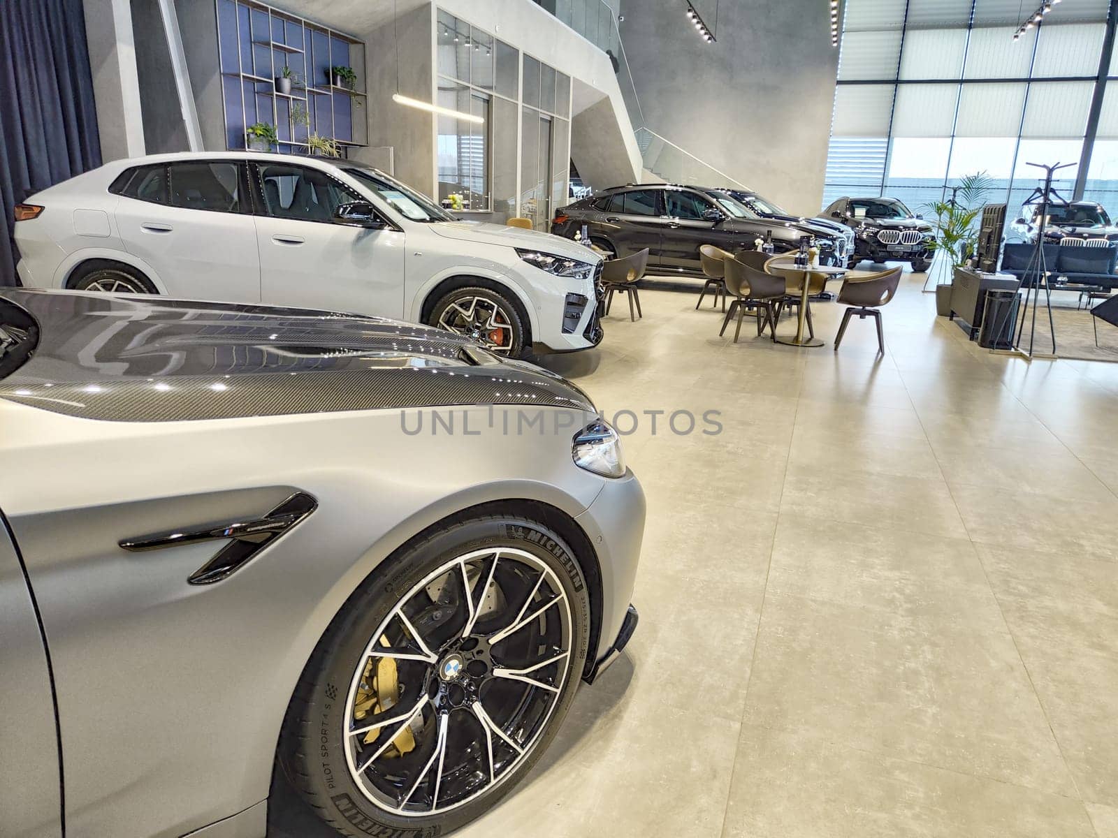 Tumen, Russia - November 09, 2024: Car in nice showroom of dealership BMW