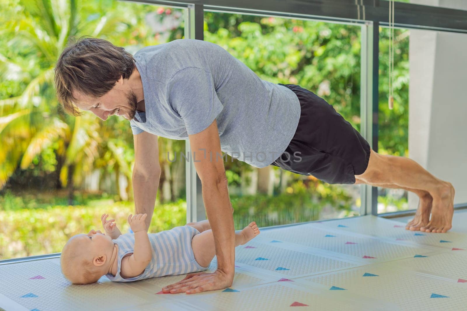 A father works out with his 3-month-old baby, doing push-ups and pausing to kiss his child. A joyful and heartwarming moment combining fitness, bonding, and fatherhood. Parenting, love, and active lifestyle concept.