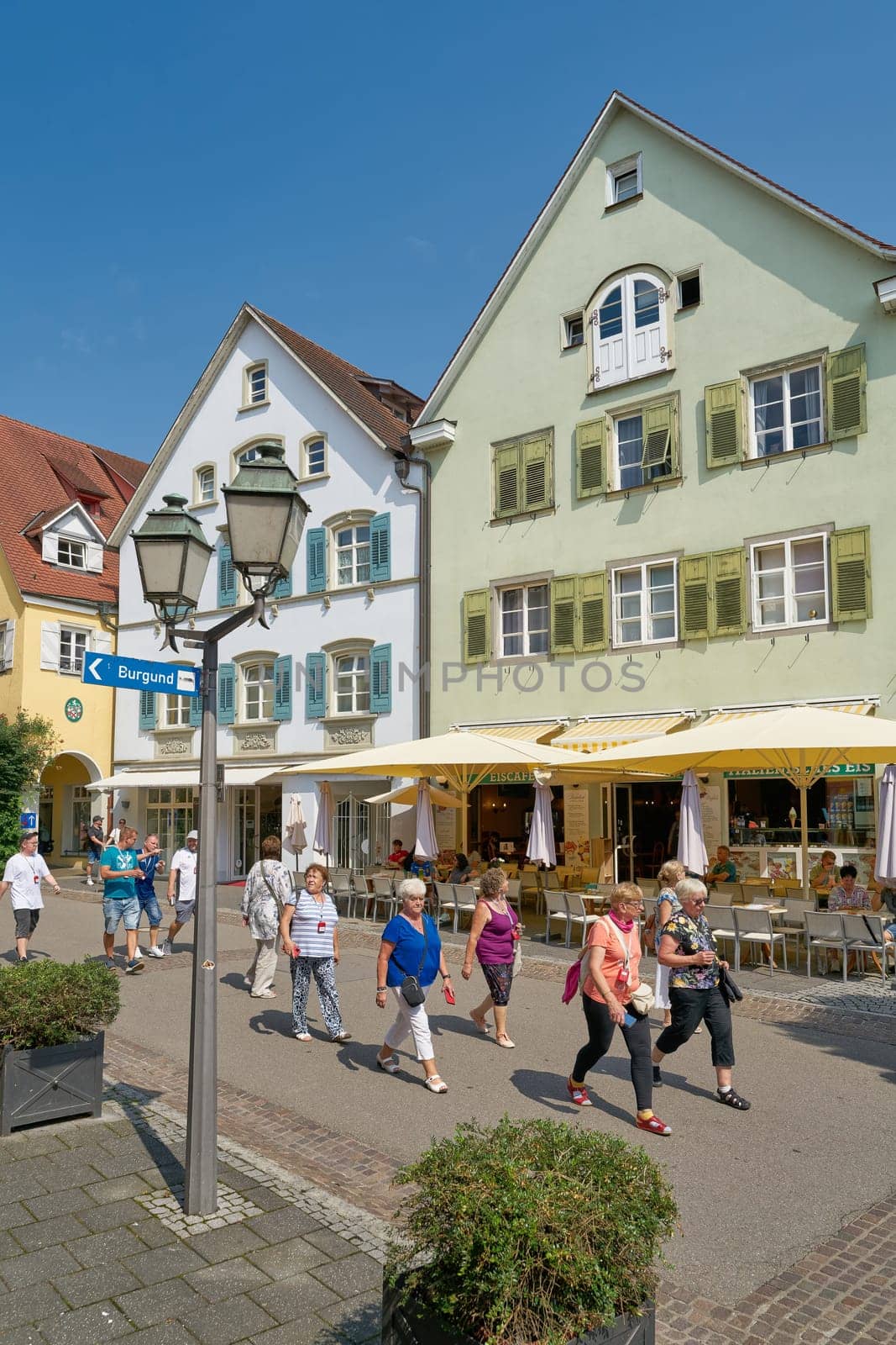 Meersburg, Germany – August 03, 2024: Tour group on the road in the historic old town, lower town of Meersburg on Lake Constance in Germany