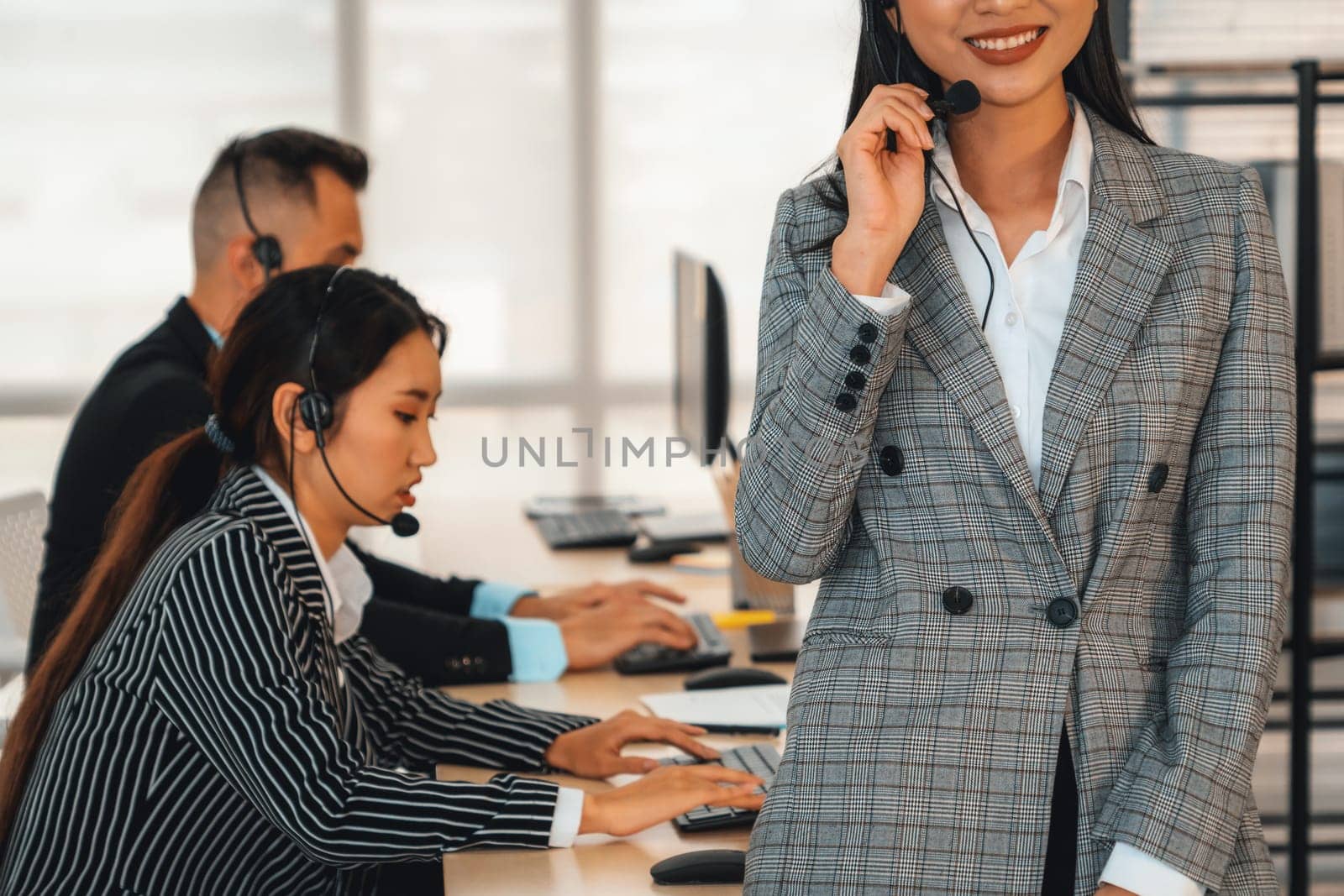 Business people wearing headset working in office Jivy by biancoblue